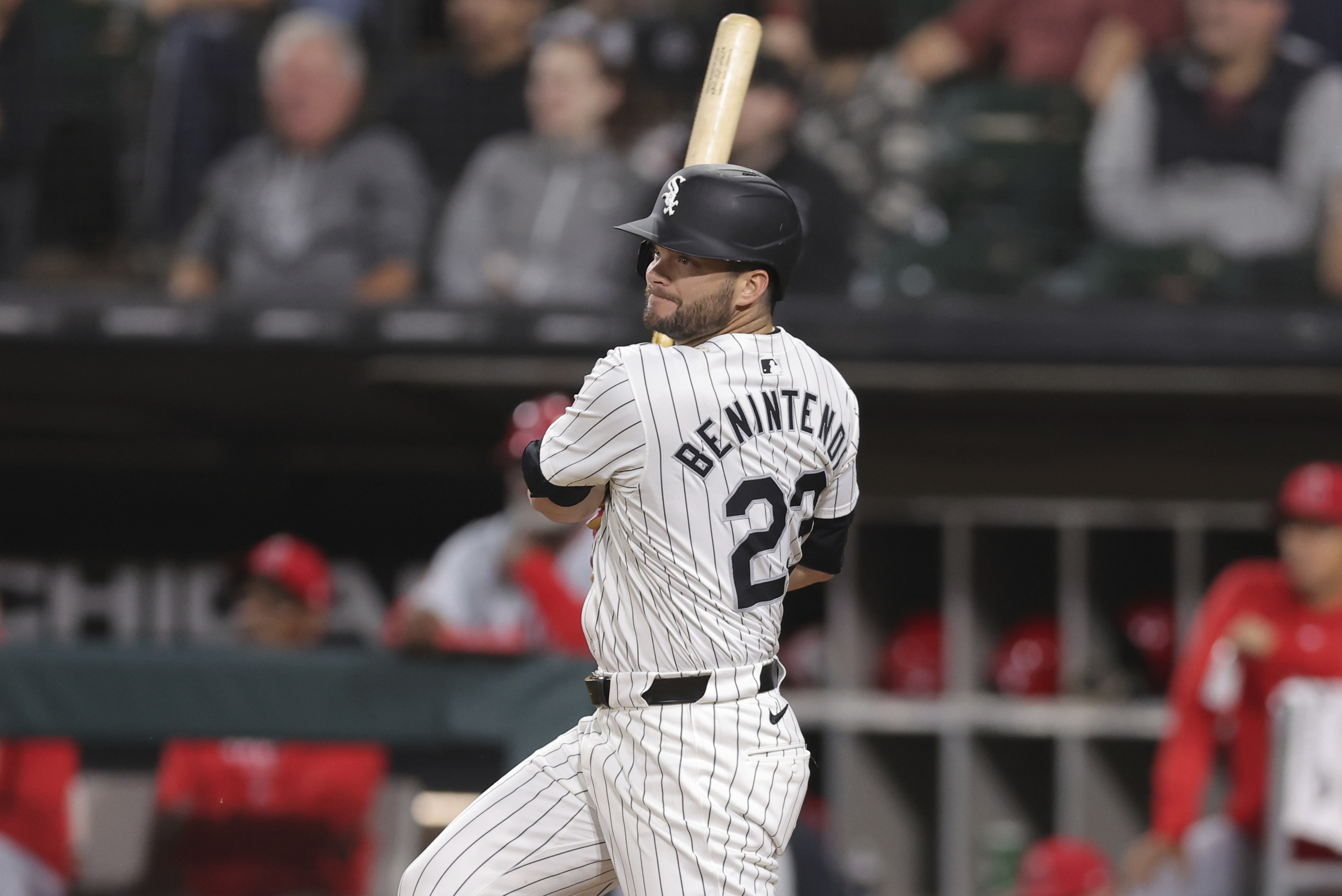 Chicago White Sox's Andrew Benintendi hits an RBI single during the eighth inning of a baseball game against the Los Angeles Angels, Tuesday, Sept. 24, 2024, in Chicago. 