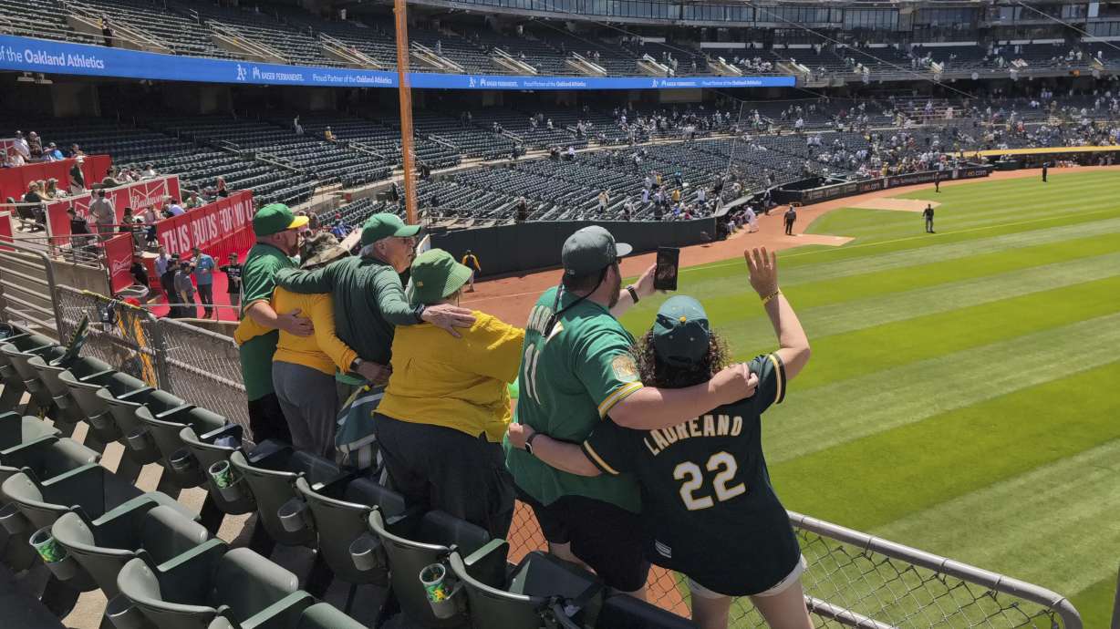 "Right-Field" Will MacNeil and several other A's fans sing "Take Me Out To The Ballgame" in the Oakland Coliseum during the seventh-inning stretch of a game against the Pittsburgh Pirates on May 1, 2024, in Oakland, Calif.