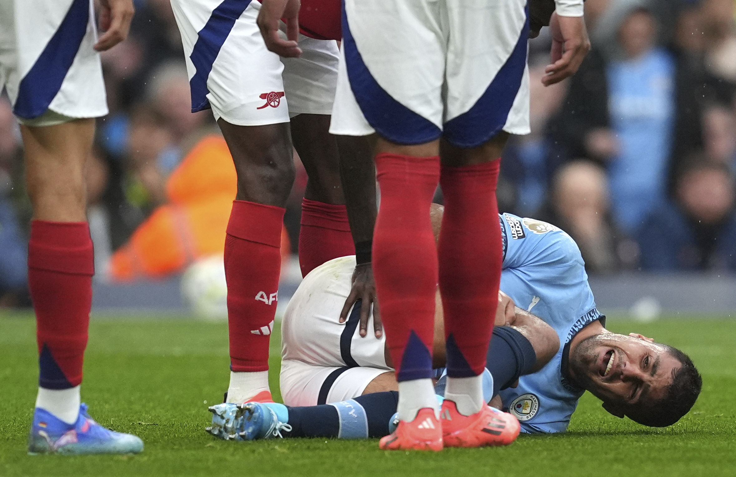 Manchester City's Rodri reacts to an injury, during the English Premier League soccer match between Manchester City and Arsenal at the Etihad stadium in Manchester, England, Sunday, Sept. 22, 2024.