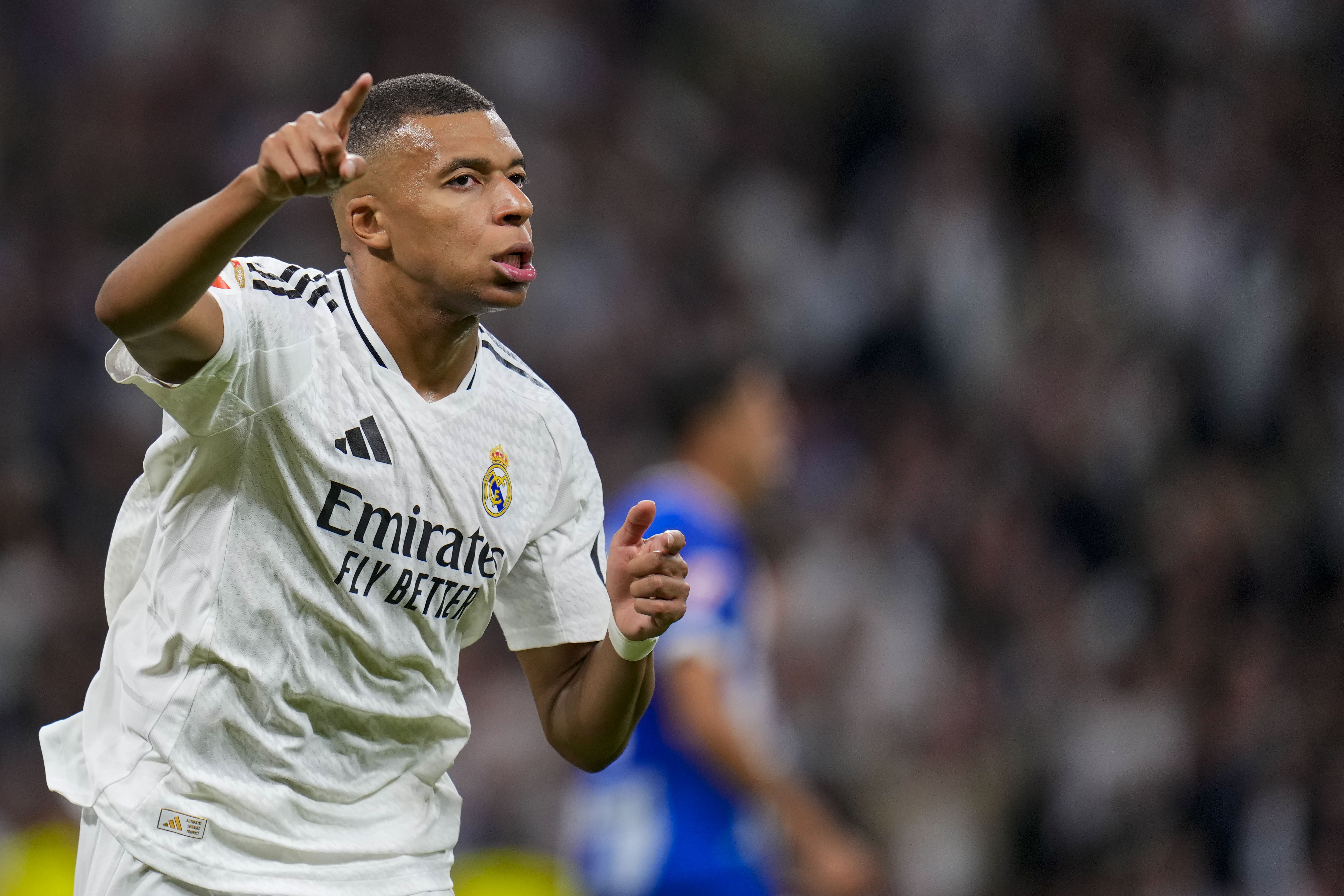 Real Madrid's Kylian Mbappe celebrates after scoring his side's second goal during a Spanish La Liga soccer match between Real Madrid and Alaves at Santiago Bernabeu stadium in Madrid, Spain, Tuesday, Sept. 24, 2024. 