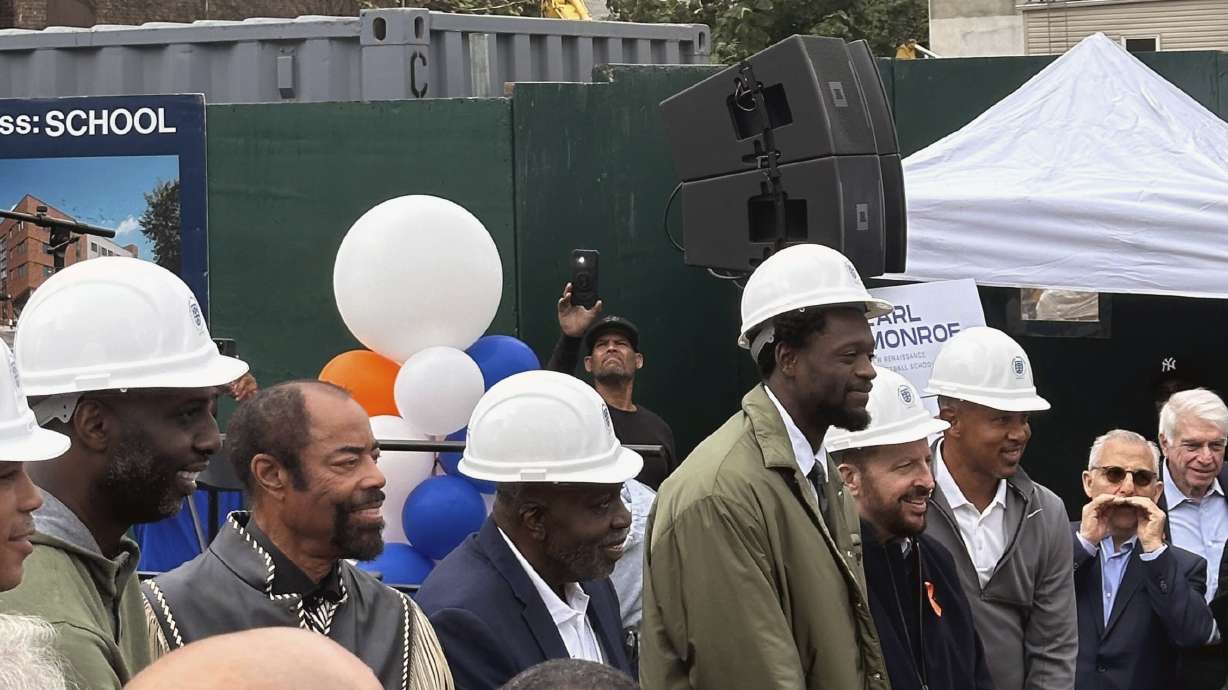 Former New York Knicks basketball players Walt Frazier, second from left without a hard hat, Earl Monroe, center left, Knicks forward Julius Randle, Knicks coach Tom Thibodeau and former Knicks player John Starks attend a groundbreaking ceremony for the Earl Monroe New Renaissance Basketball School, where the basketball court will be named for Randle, Wednesday, Sept. 25, 2024, in New York.