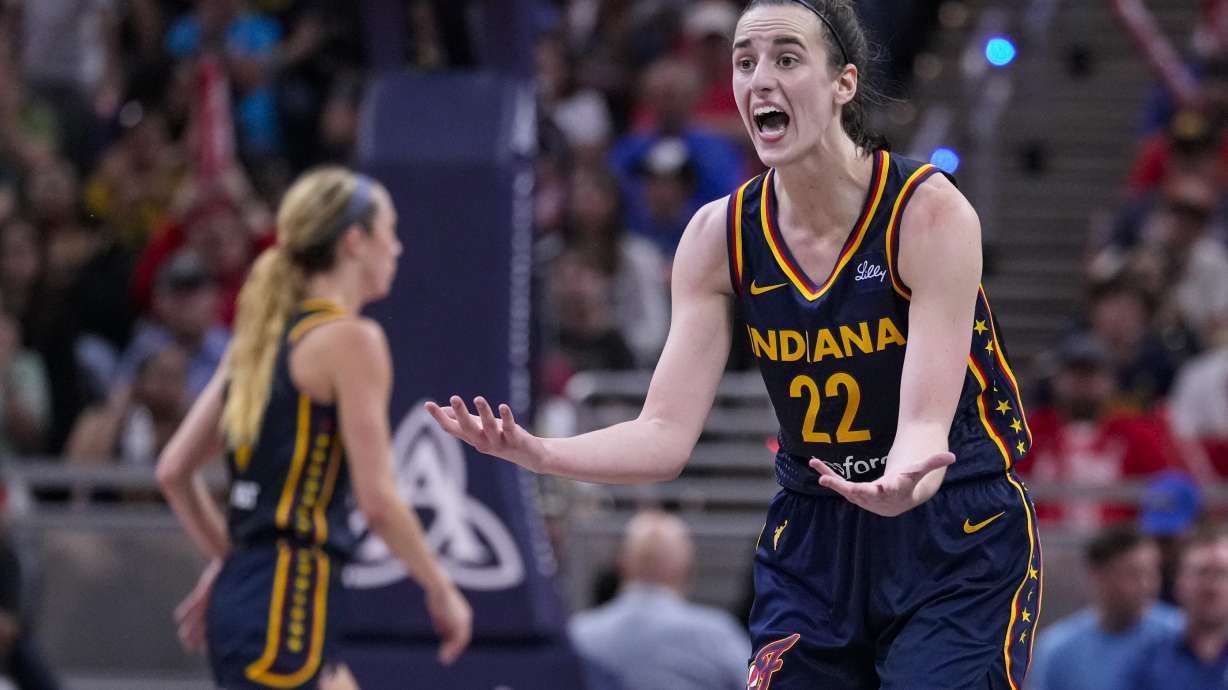 Indiana Fever guard Caitlin Clark (22) questions the lack of a foul in the second half of a WNBA basketball game against the Dallas Wings in Indianapolis, Sunday, Sept. 15, 2024.