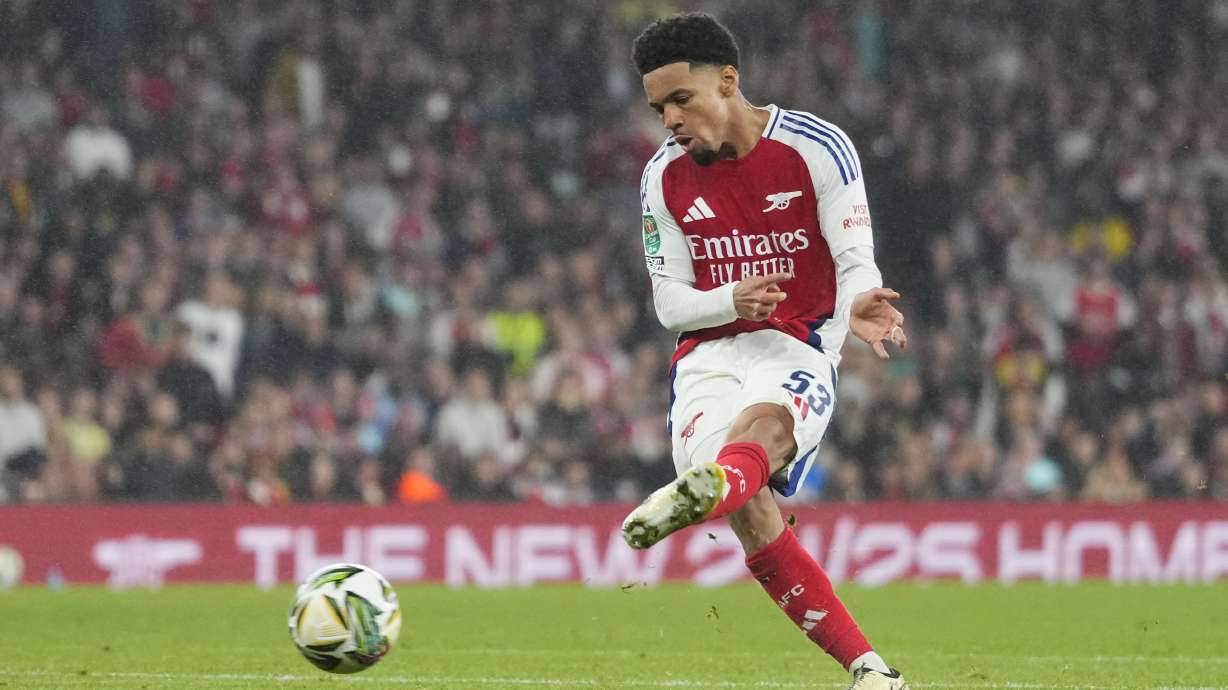 Arsenal's Ethan Nwaneri scores his side's the third goal during the English League Cup third round soccer match between Arsenal and Bolton Wanderers at the Emirates stadium in London, Wednesday, Sept. 25, 2024.