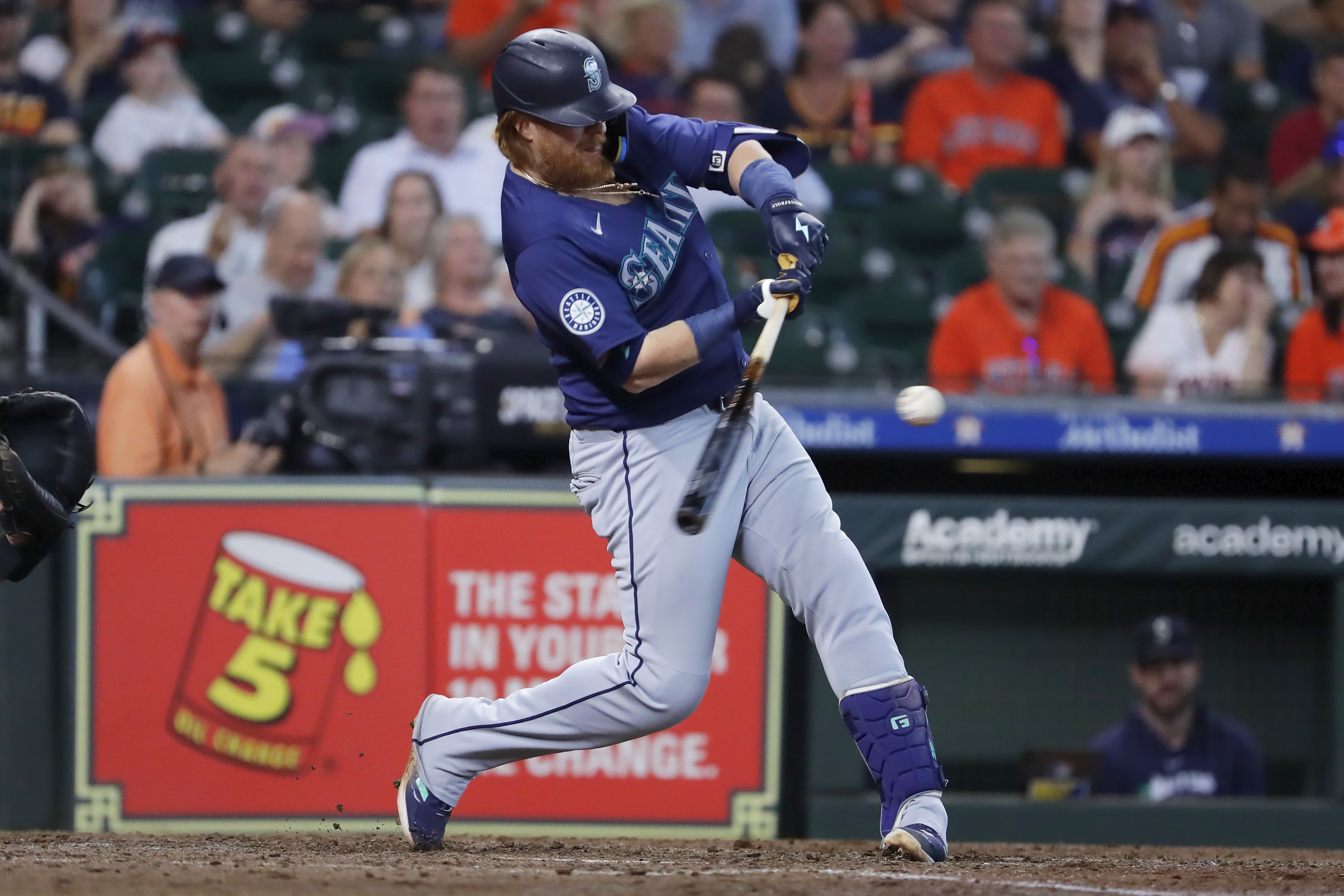 Seattle Mariners' Justin Turner hits a two-run RBI single against the Houston Astros during the sixth inning of a baseball game Wednesday, Sept. 25, 2024, in Houston. 