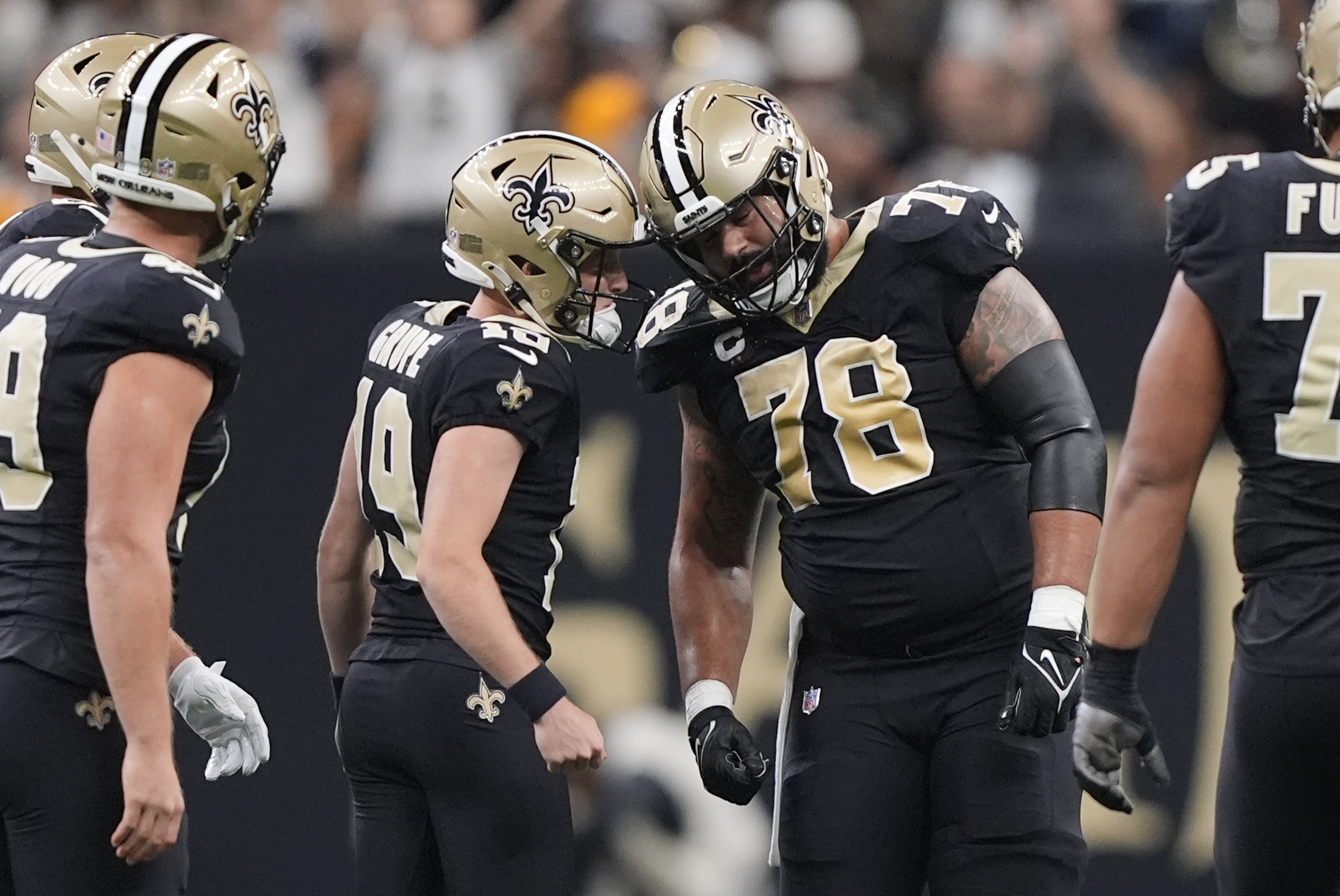 New Orleans Saints place-kicker Blake Grupe (19) is congratulated by center Erik McCoy (78) after a field goal during the first half of an NFL football game against the Carolina Panthers, Sunday, Sept. 8, 2024, in New Orleans. 