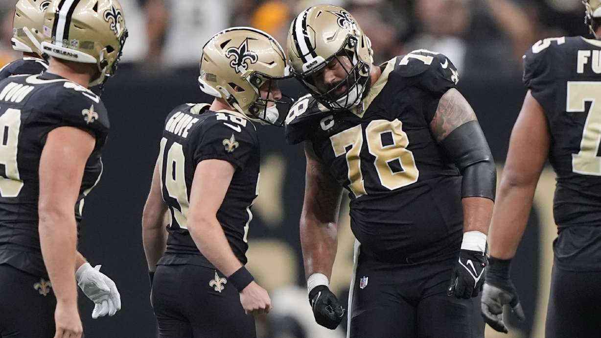New Orleans Saints place-kicker Blake Grupe (19) is congratulated by center Erik McCoy (78) after a field goal during the first half of an NFL football game against the Carolina Panthers, Sunday, Sept. 8, 2024, in New Orleans.