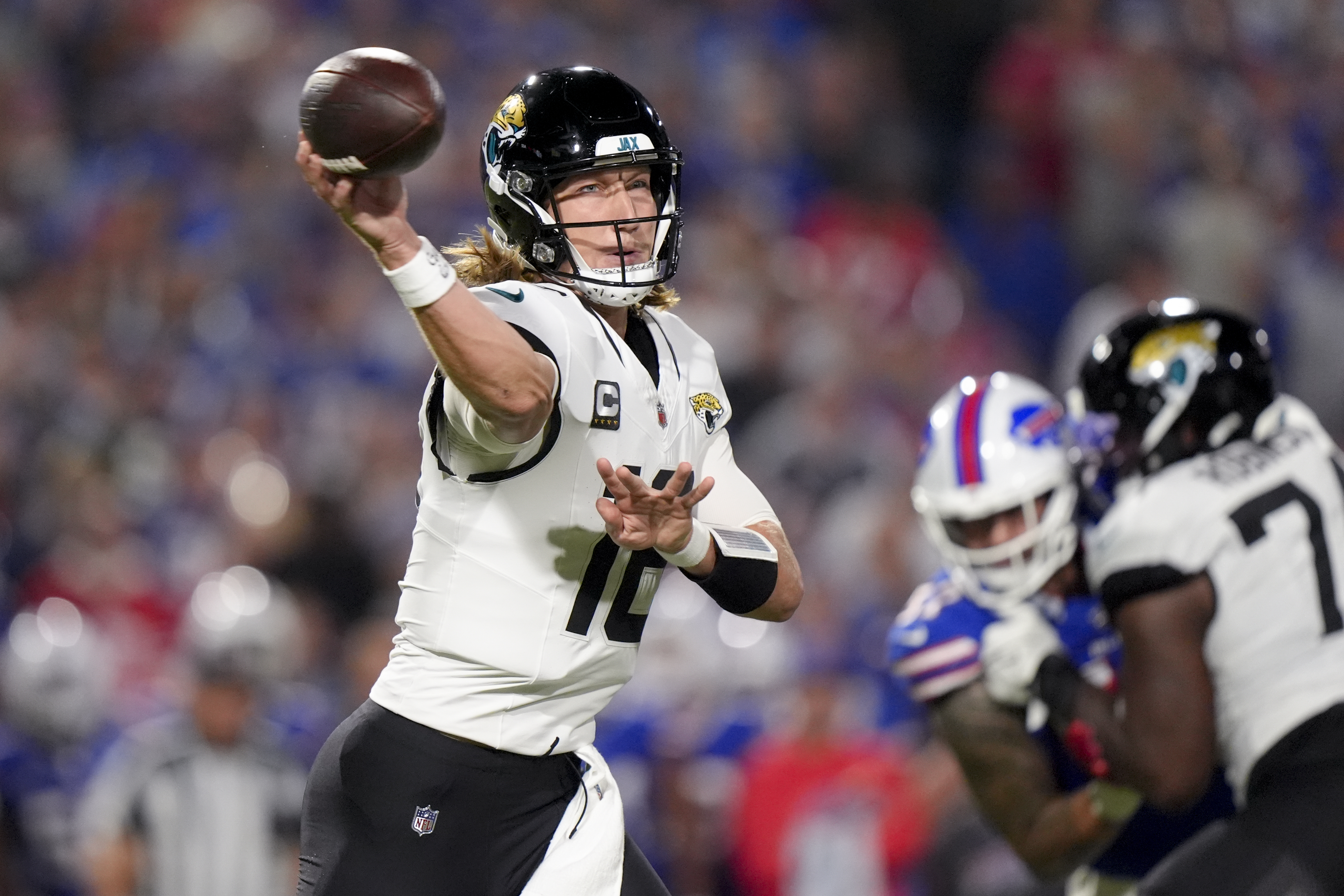Jacksonville Jaguars quarterback Trevor Lawrence (16) throws a pass during the first half of an NFL football game against the Buffalo Bills, Monday, Sept. 23, 2024, in Orchard Park, NY.