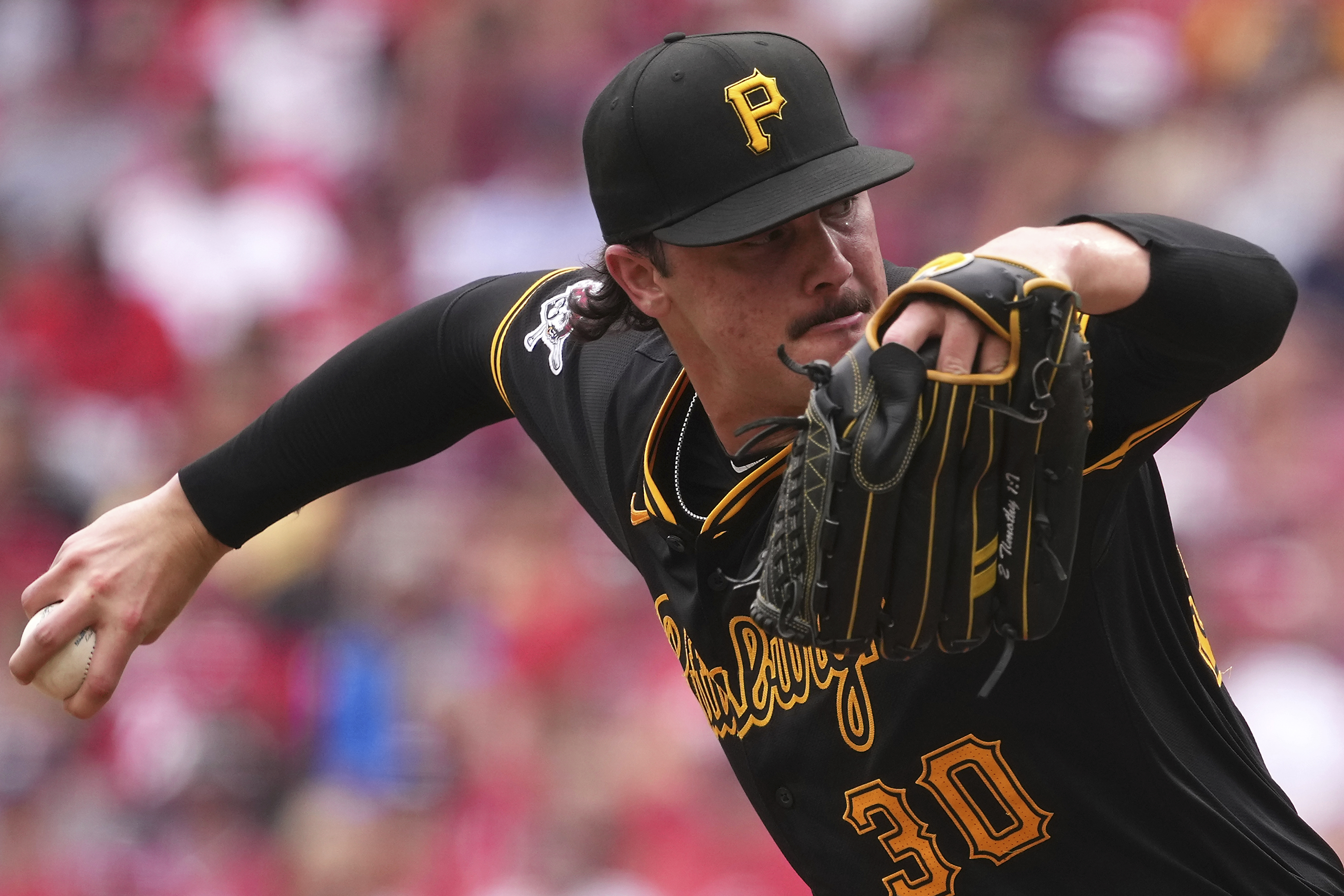 Pittsburgh Pirates' Paul Skenes delivers a pitch during the fourth inning of a baseball game against the Cincinnati Reds, Sunday, Sept. 22, 2024, in Cincinnati. 