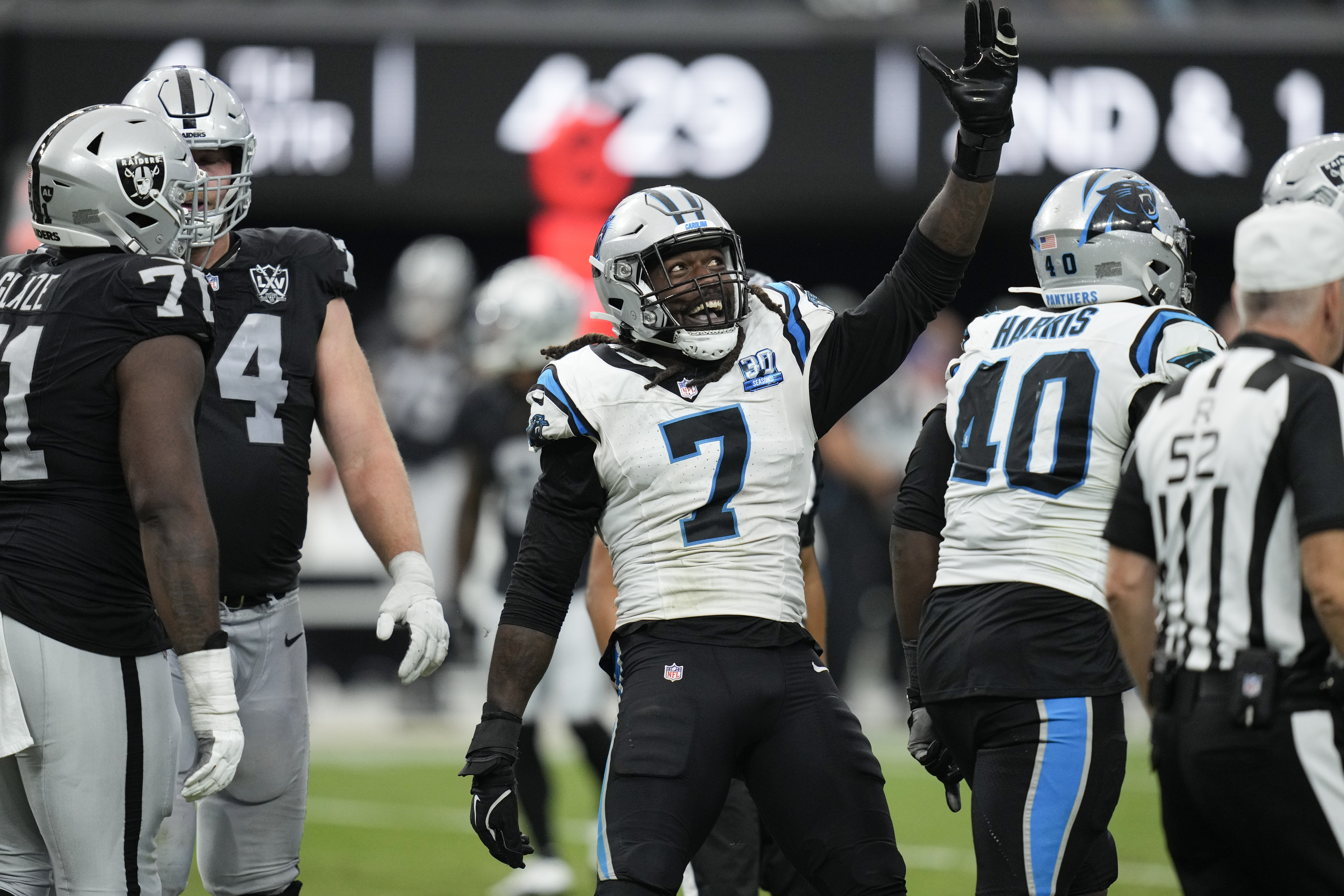 Carolina Panthers linebacker Jadeveon Clowney celebrates after sacking Las Vegas Raiders quarterback Aidan O'Connell during the second half of an NFL football game, Sunday, Sept. 22, 2024, in Las Vegas. 
