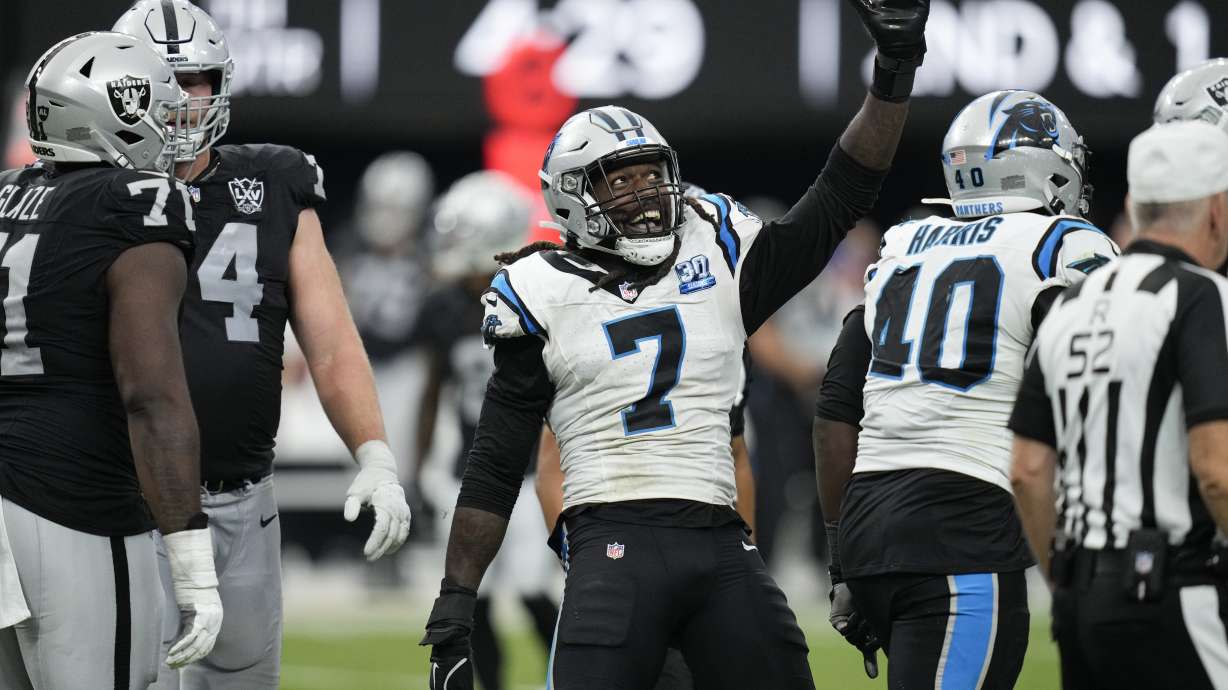 Carolina Panthers linebacker Jadeveon Clowney celebrates after sacking Las Vegas Raiders quarterback Aidan O'Connell during the second half of an NFL football game, Sunday, Sept. 22, 2024, in Las Vegas.