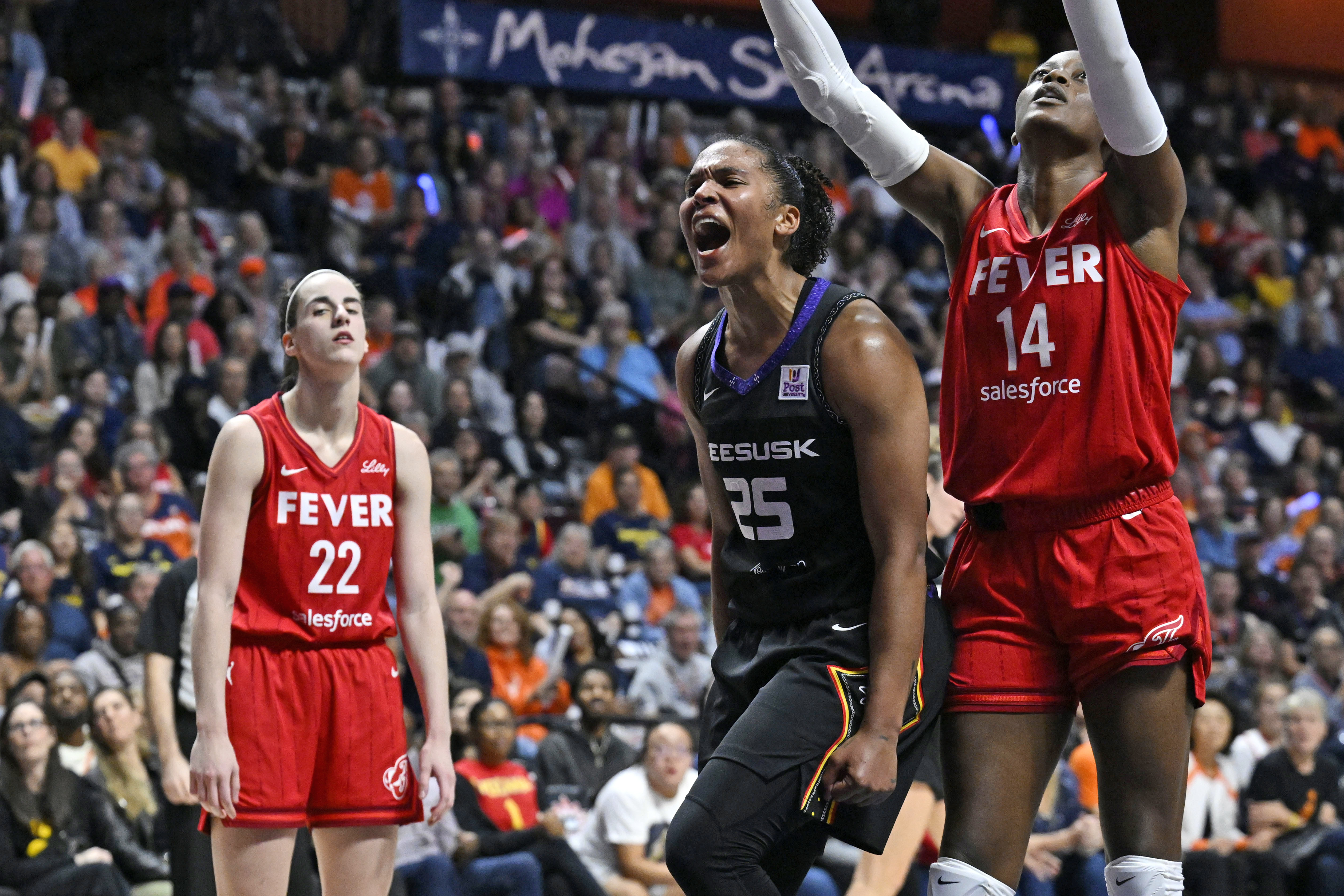 Connecticut Sun forward Alyssa Thomas (25) celebrates a basket while being fouled during the second half in Game 2 of a first-round WNBA basketball playoff series against the Indiana Fever, Wednesday, Sept. 25, 2024, in Uncasville, Conn.