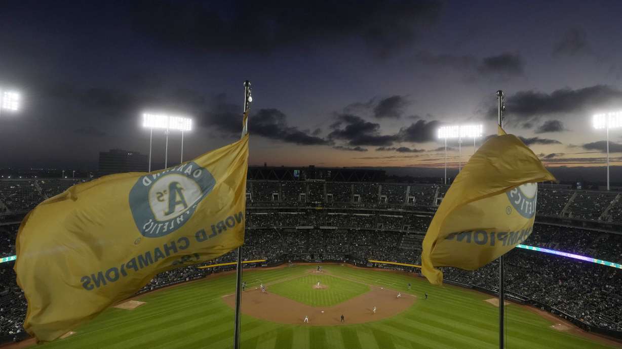 Fans at the Oakland Coliseum watch during the third inning of a baseball game between the Oakland Athletics and the Texas Rangers in Oakland, Calif., Wednesday, Sept. 25, 2024.