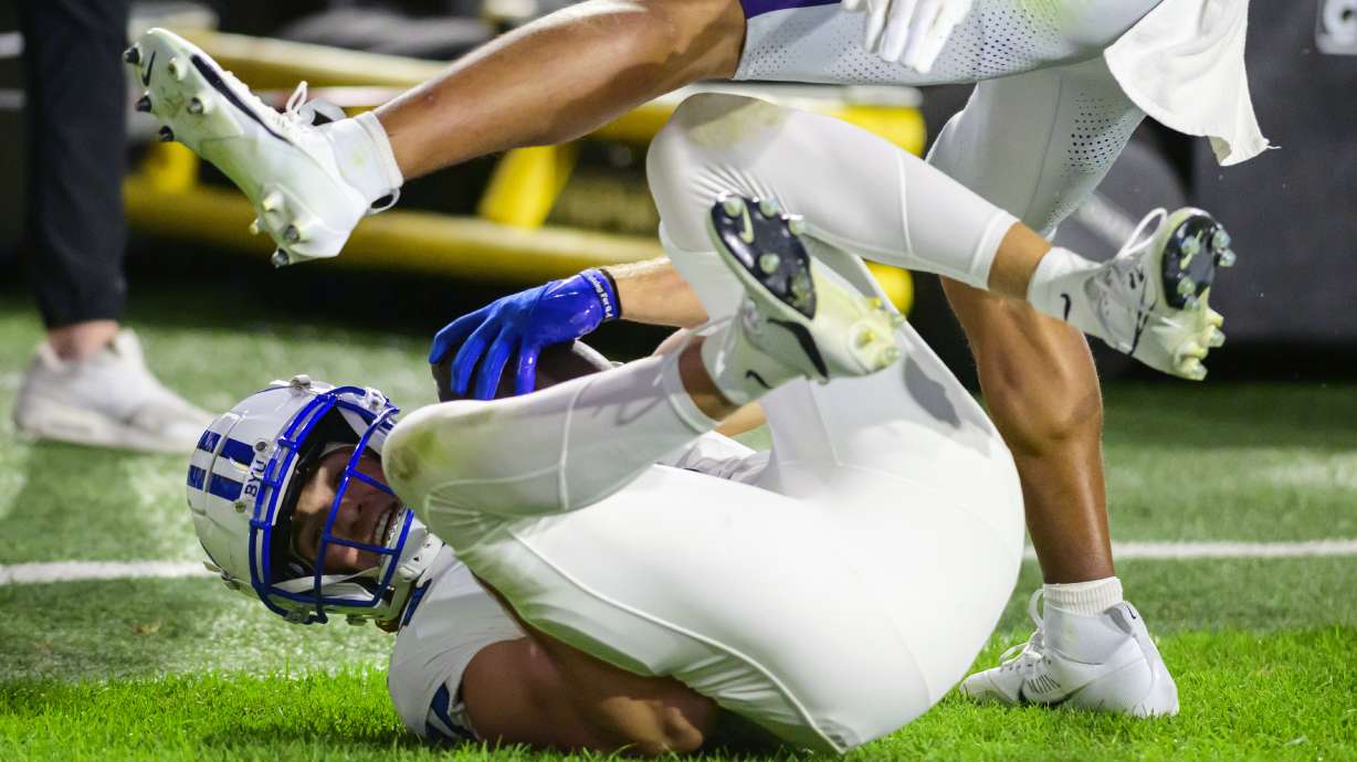 BYU wide receiver Chase Roberts, bottom, makes the diving catch for a touchdown during an NCAA college football game against Kansas State, Saturday, Sept. 21, 2024, in Provo, Utah.