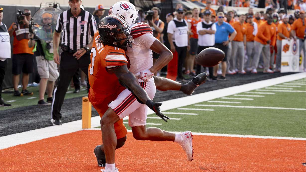 Utah safety Rabbit Evans (13) is called for defensive pass interference on Oklahoma State running back Ollie Gordon II (0) during a two-point conversion attempt in the second half of an NCAA college football game Saturday, Sept. 21, 2024, in Stillwater, Okla.