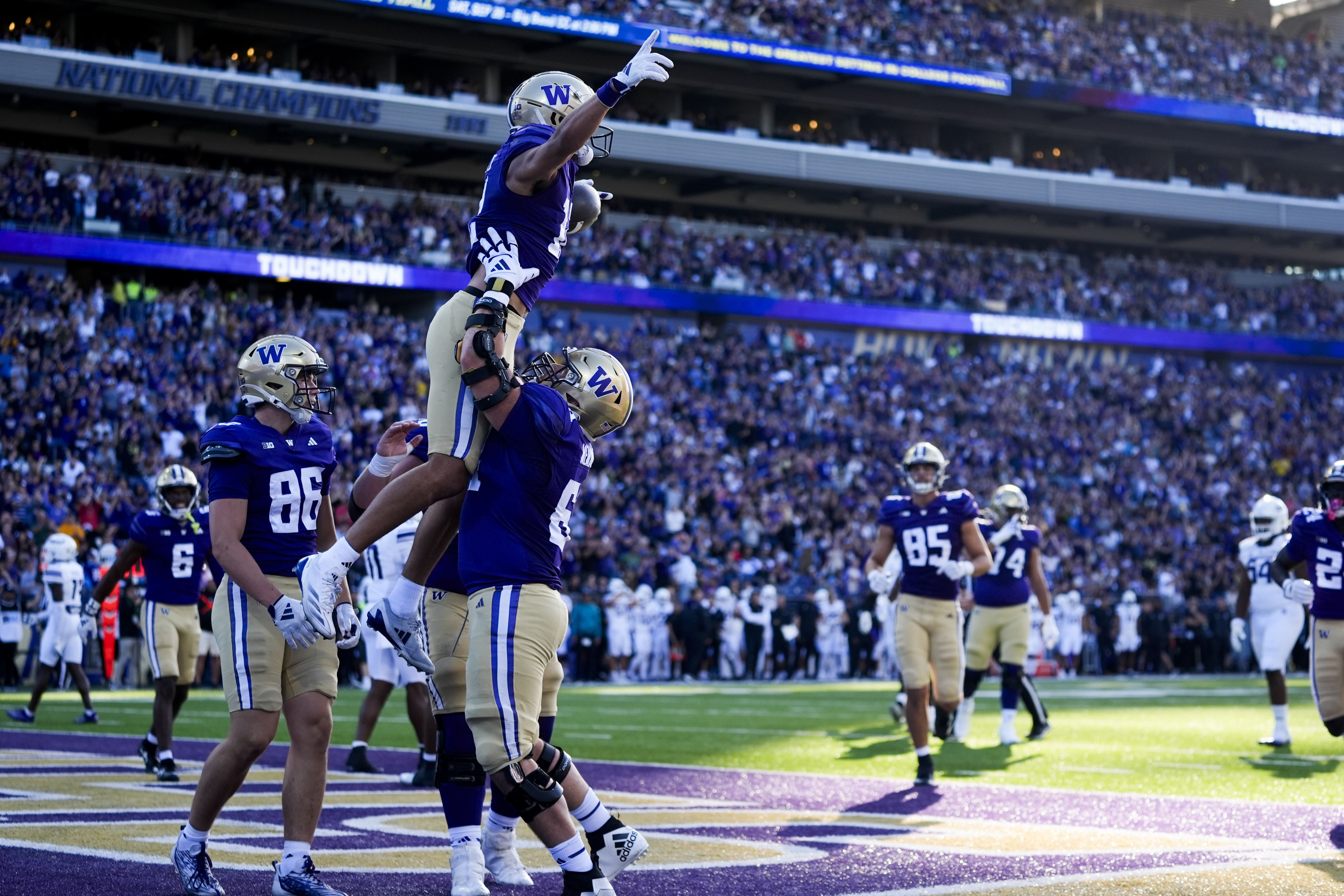 Washington wide receiver Denzel Boston celebrates scoring a touchdown against Northwestern during the first half of an NCAA college football game Saturday, Sept. 21, 2024, in Seattle. 