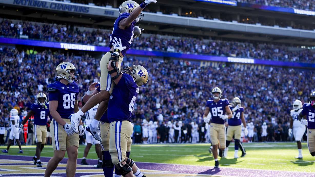 Washington wide receiver Denzel Boston celebrates scoring a touchdown against Northwestern during the first half of an NCAA college football game Saturday, Sept. 21, 2024, in Seattle.