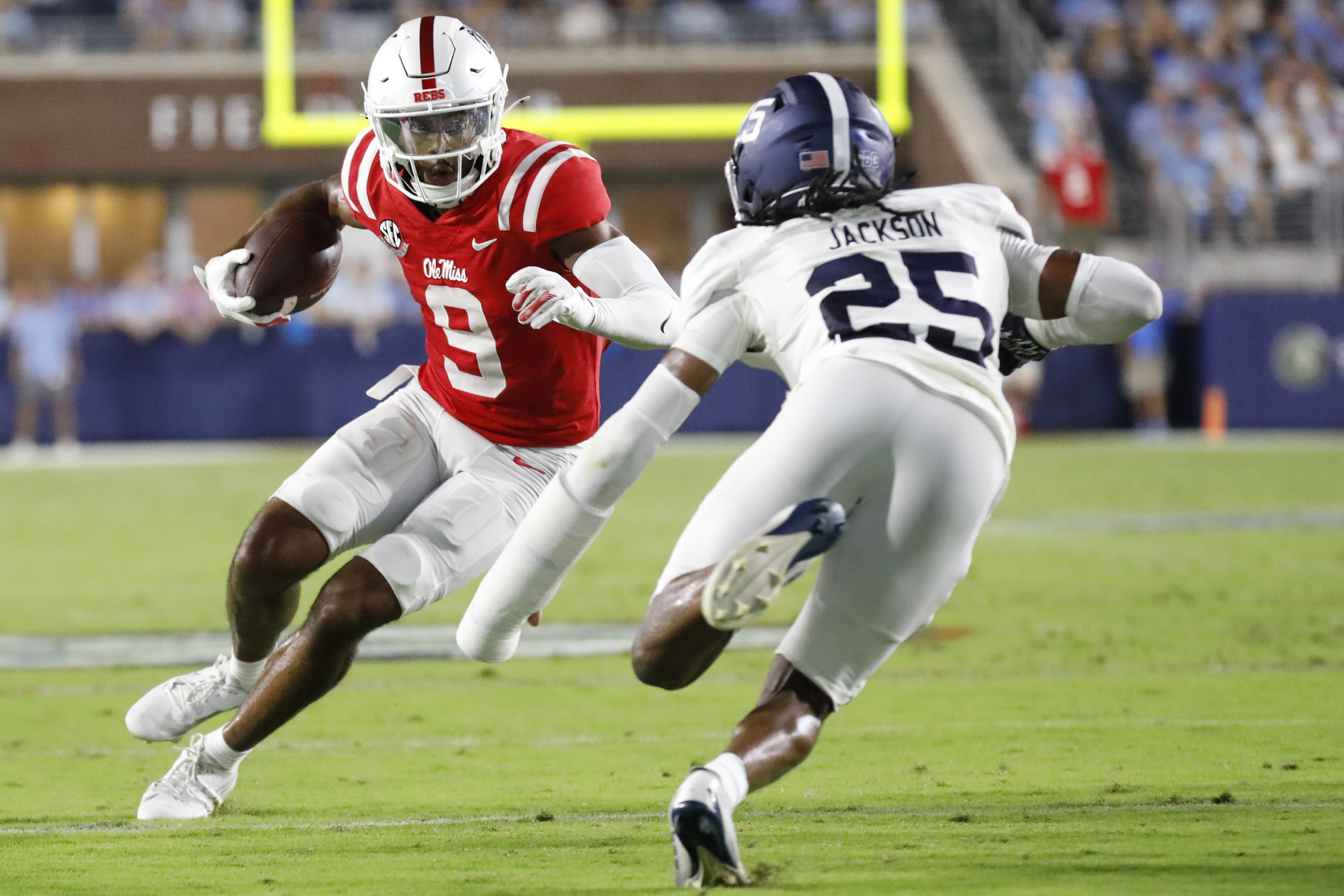 Mississippi wide receiver Tre Harris III (9) dodges Georgia Southern defensive back Ayden Jackson (25) while running the ball during the first half of an NCAA college football game, Saturday, Sept. 21, 2024, in Oxford, Miss. 