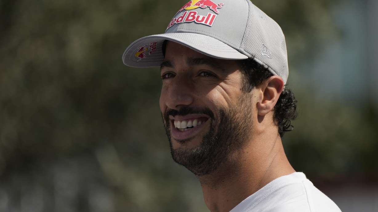 RB driver Daniel Ricciardo of Australia smiles in the paddock at the Baku circuit, in Baku, Azerbaijan, Thursday, Sept.12, 2024. The Formula One Grand Prix will be held on Sunday.