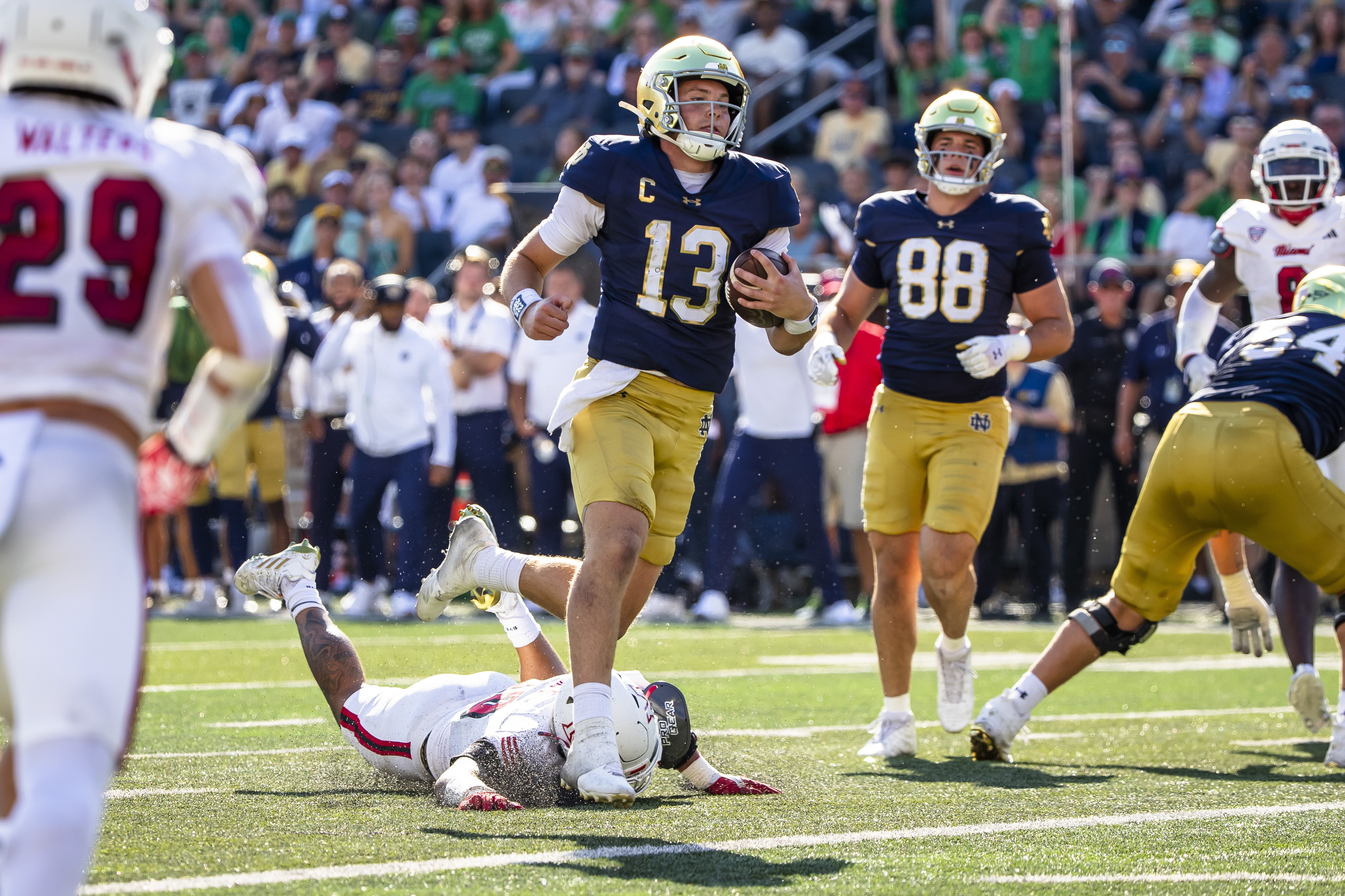 Notre Dame quarterback Riley Leonard (13) scores a touchdown during the first half of an NCAA college football game against Miami (Ohio), Saturday, Sept. 21, 2024, in South Bend, Ind. 