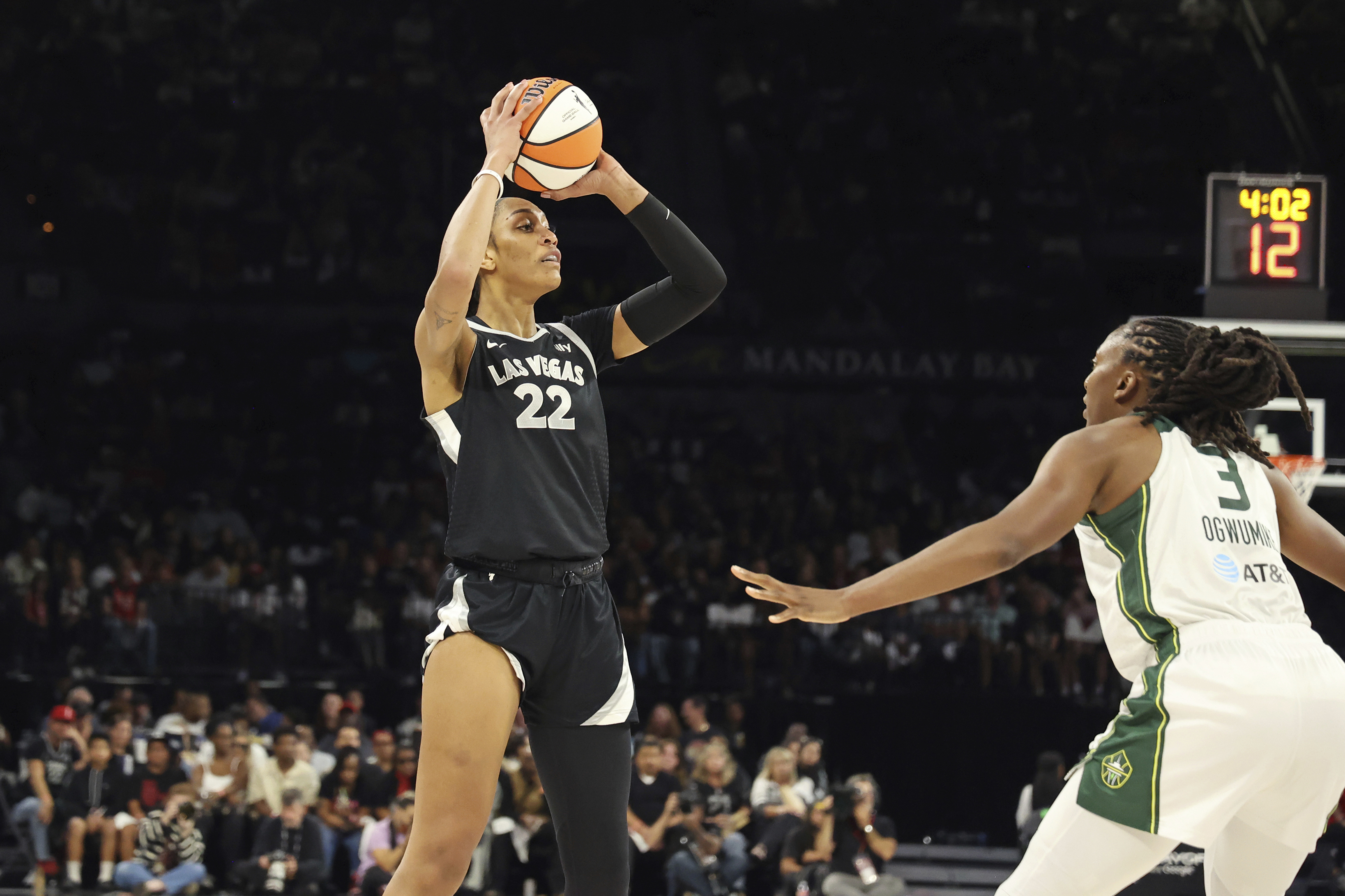 Las Vegas Aces center A'ja Wilson (22) keeps the ball away from Seattle Storm forward Nneka Ogwumike (3) during a first-round WNBA basketball playoff game Sunday, Sept. 22, 2024, in Las Vegas.