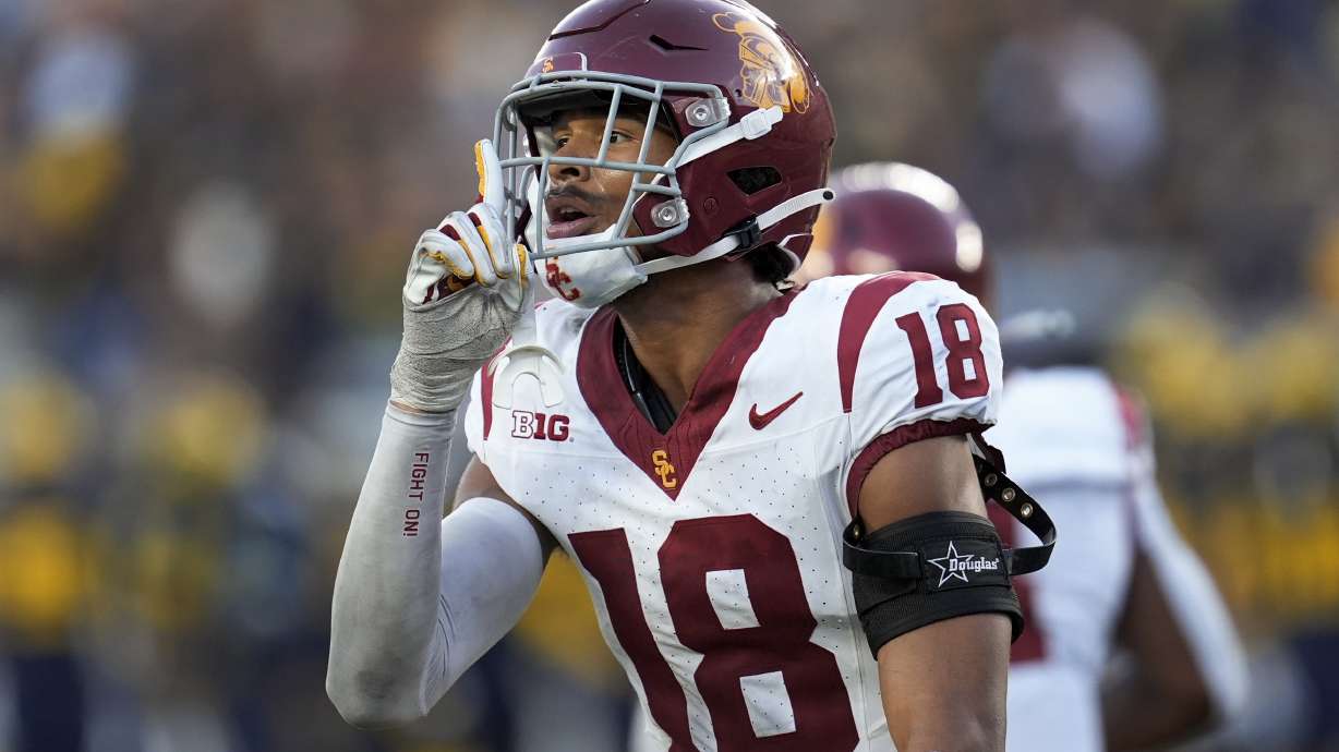 Southern California linebacker Eric Gentry reacts to the crowd against Michigan in the second half of an NCAA college football game in Ann Arbor, Mich., Saturday, Sept. 21, 2024.