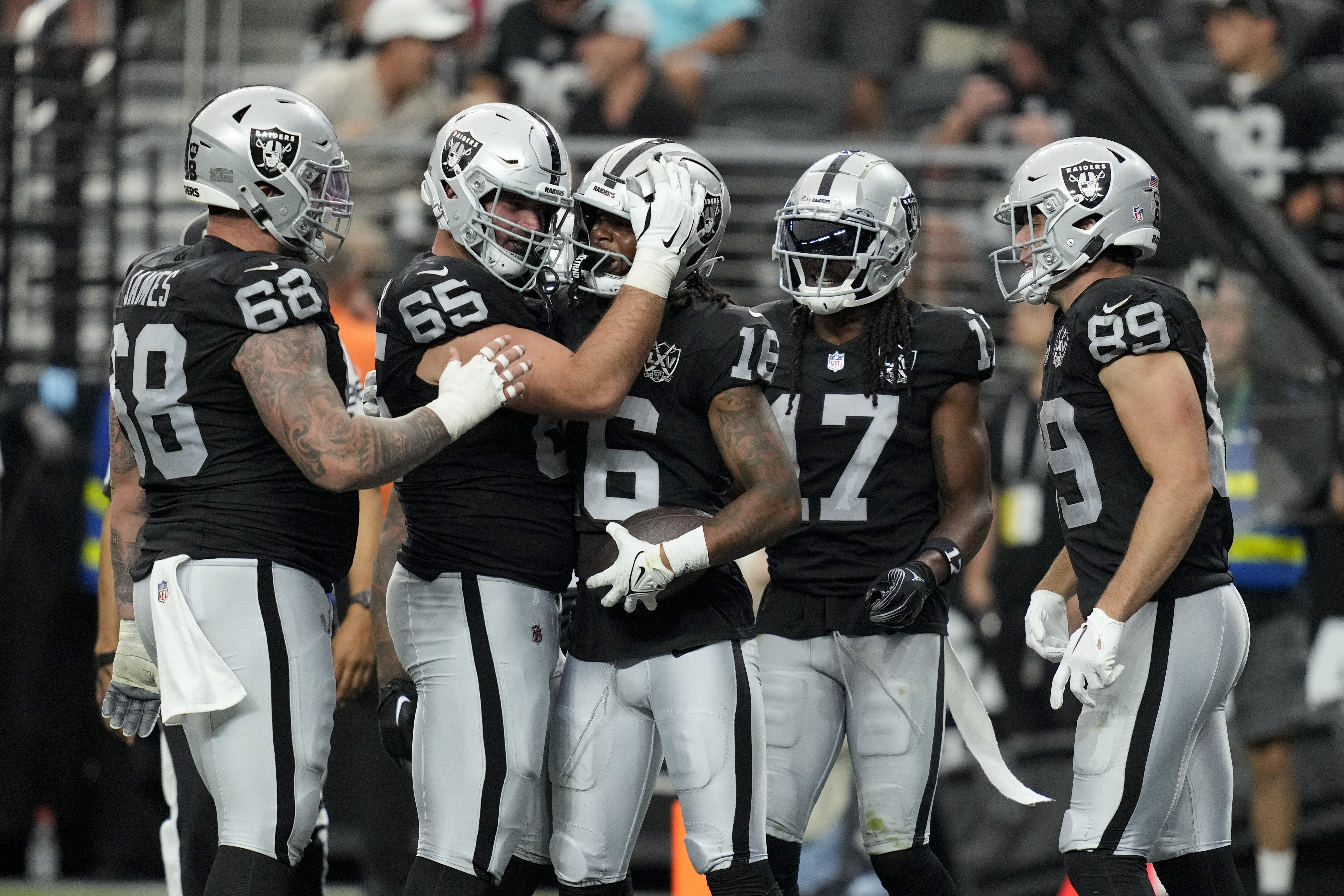 Las Vegas Raiders wide receiver Jakobi Meyers celebrates after scoring against the Carolina Panthers during the second half of an NFL football game, Sunday, Sept. 22, 2024, in Las Vegas.