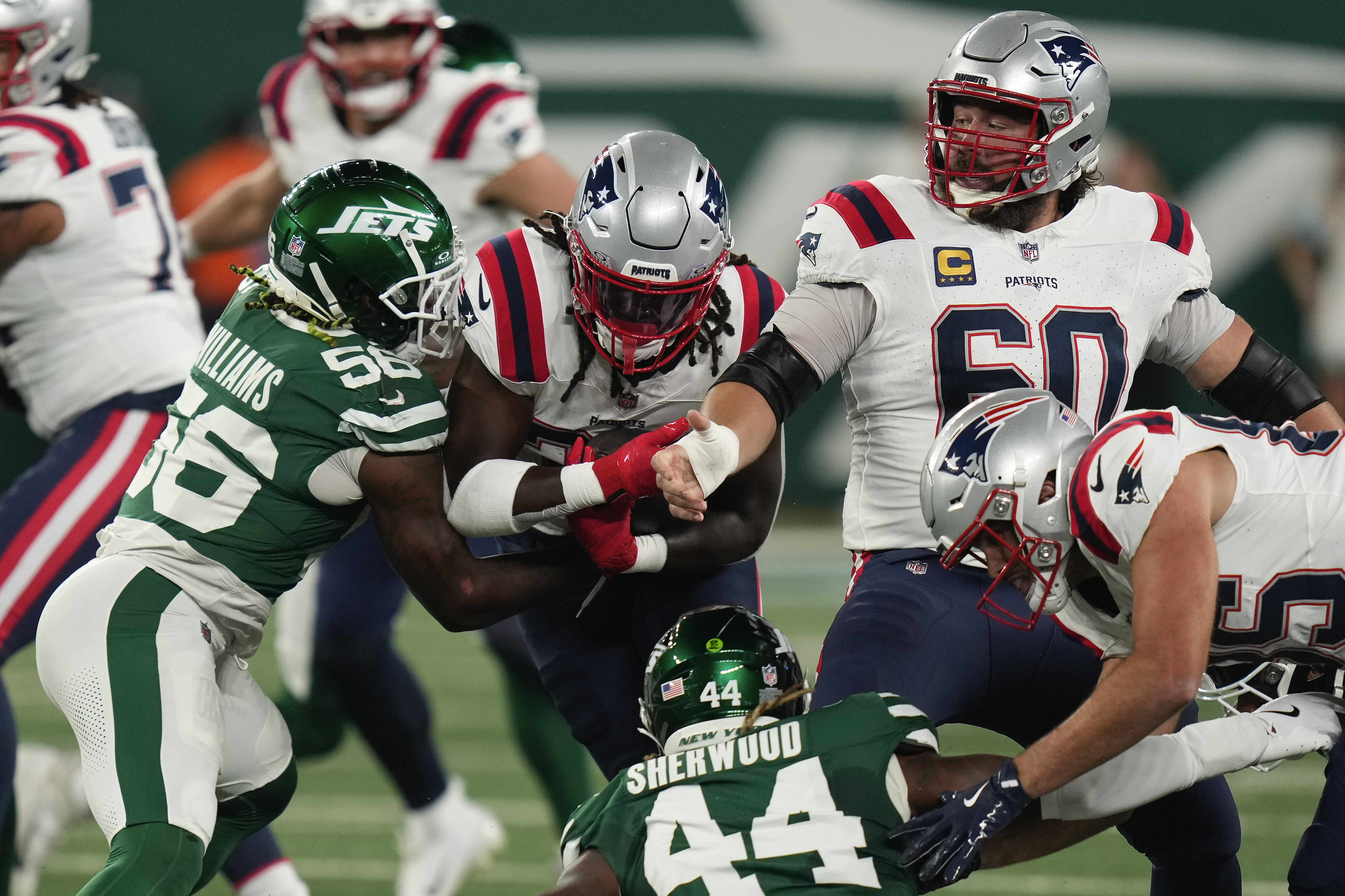 New England Patriots running back Rhamondre Stevenson (38) carries the ball against the New York Jets during the first quarter of an NFL football game, Thursday, Sept. 19, 2024, in East Rutherford, N.J. 