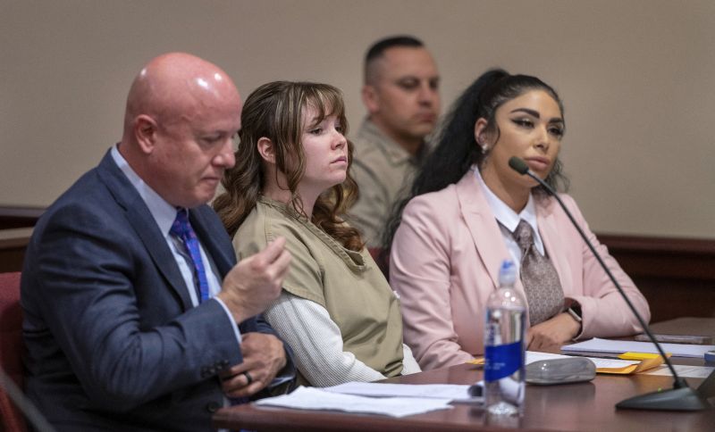 Hannah Gutierrez-Reed, center, with her attorney Jason Bowles, left, and paralegal Carmella Sisneros, right, prepare for a sentencing hearing in state district court in Santa Fe, N.M., April 15.