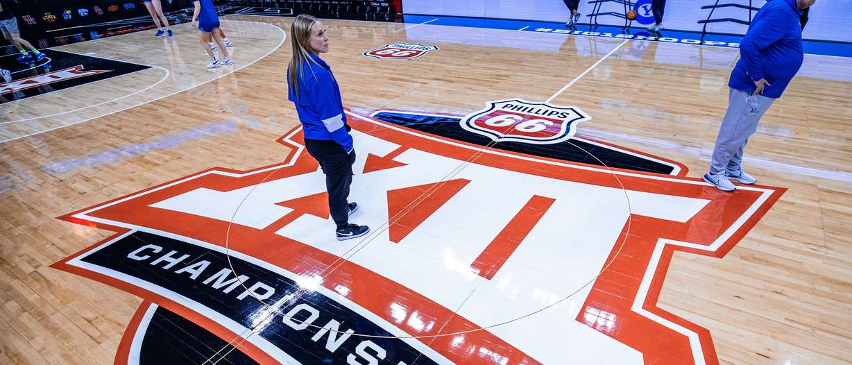 BYU head coach Amber Whiting looks around while practicing before the Big 12 women's basketball tournament at the T-Mobile Center in Kansas City, Mo.