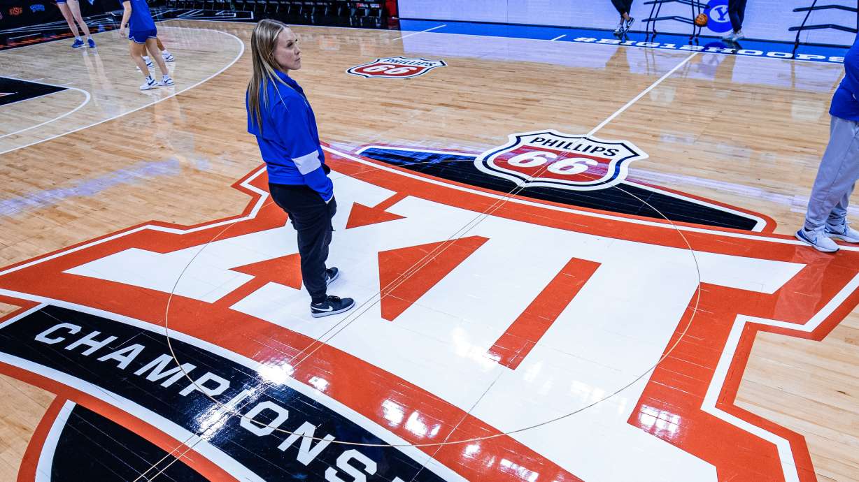 BYU head coach Amber Whiting looks around while practicing before the Big 12 women's basketball tournament at the T-Mobile Center in Kansas City, Mo.