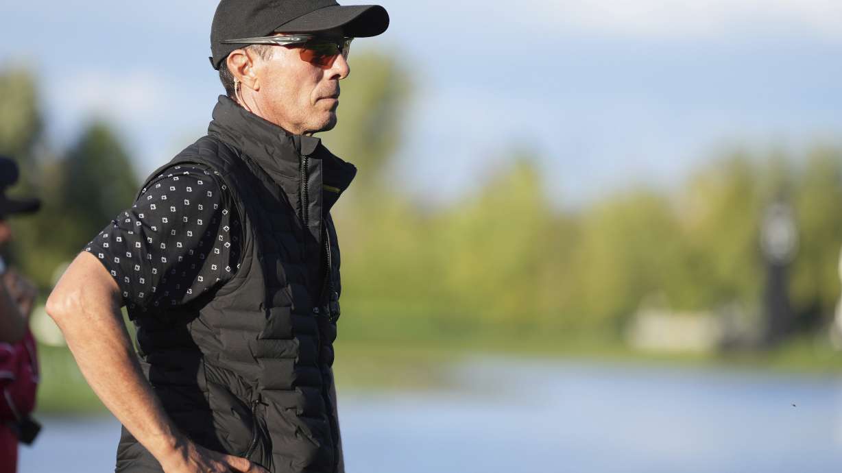 International team captain Mike Weir watches the action on the the 16th hole during a first round four-ball match at the Presidents Cup golf tournament at the Royal Montreal Golf Club in Montreal, Thursday, Sept. 26, 2024.