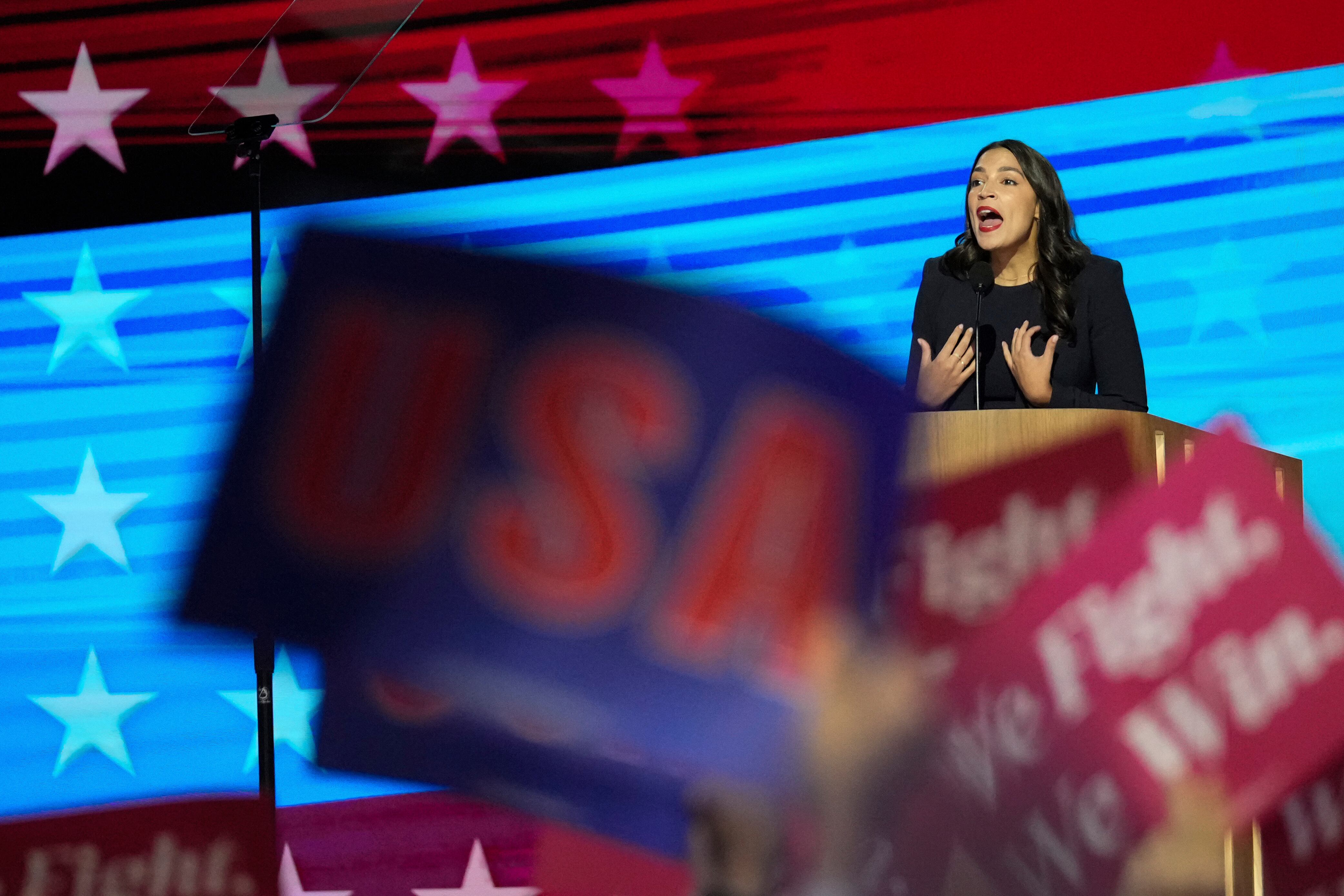 Rep. Alexandria Ocasio-Cortez, D-N.Y., speaks during the Democratic National Convention on Aug. 19, in Chicago. She and Republican Utah Rep. John Curtis offered each other support on their bills this week.