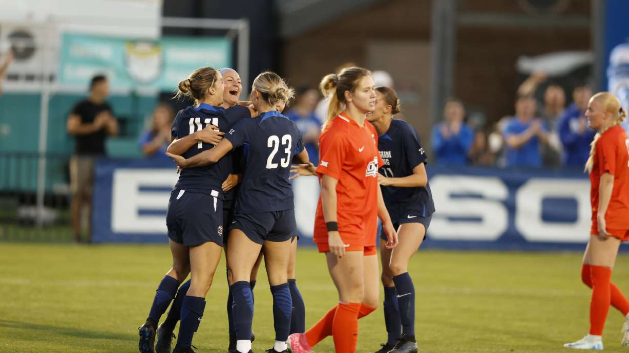 BYU's Presley Freeman, center, celebrates teammate Mika Krommenhoek's goal during a Big 12 women's soccer match against Oklahoma State, Thursday, Sept. 25, 2024 at South Field in Provo, Utah.