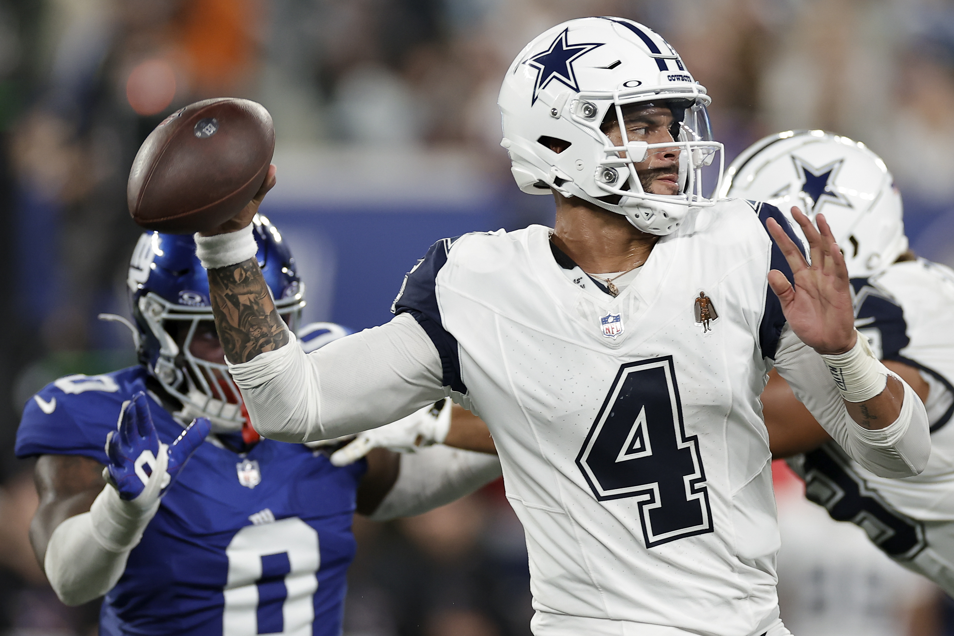 Dallas Cowboys quarterback Dak Prescott (4) passes against the New York Giants during the second quarter of an NFL football game, Thursday, Sept. 26, 2024, in East Rutherford, N.J. 