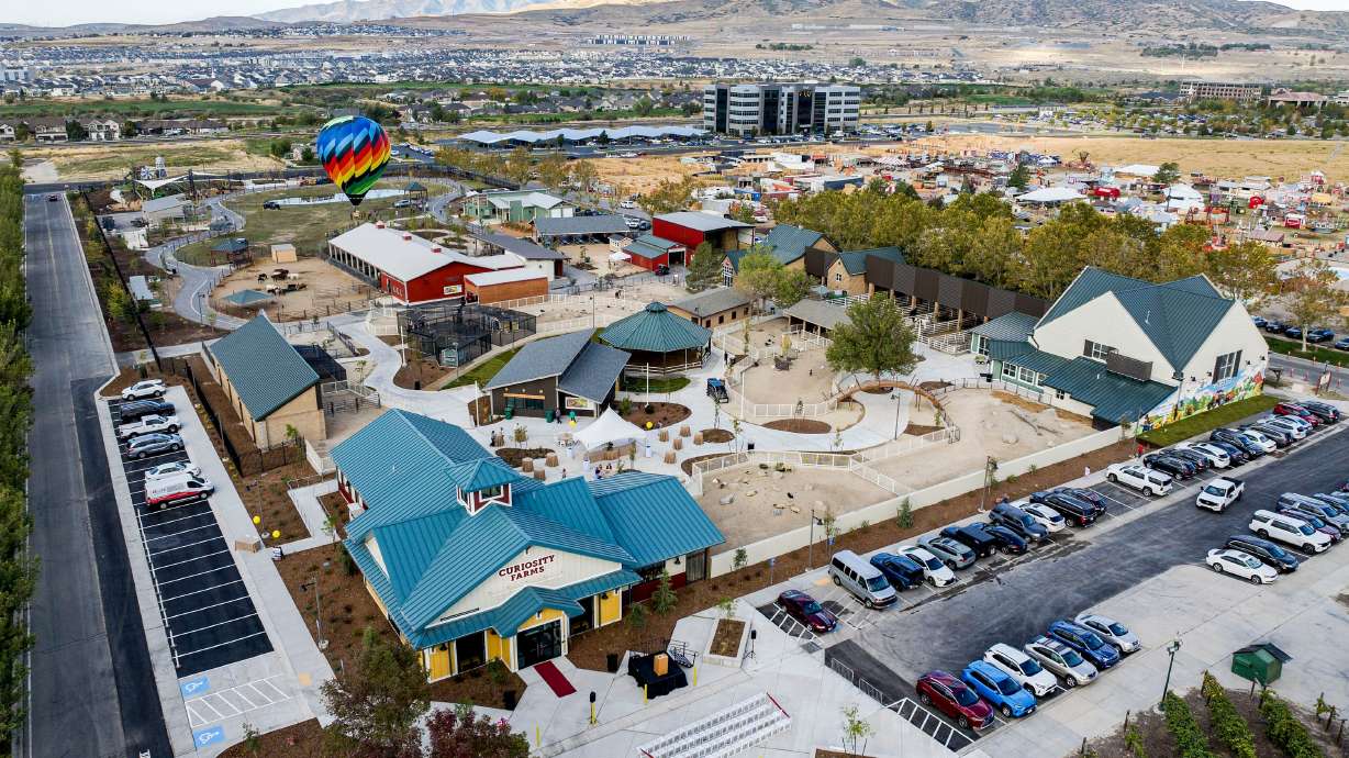 A hot air balloon named Alchemy rises above Curiosity Farms at Thanksgiving Point in Lehi on Thursday. The outdoor venue is an immersive experience for children.