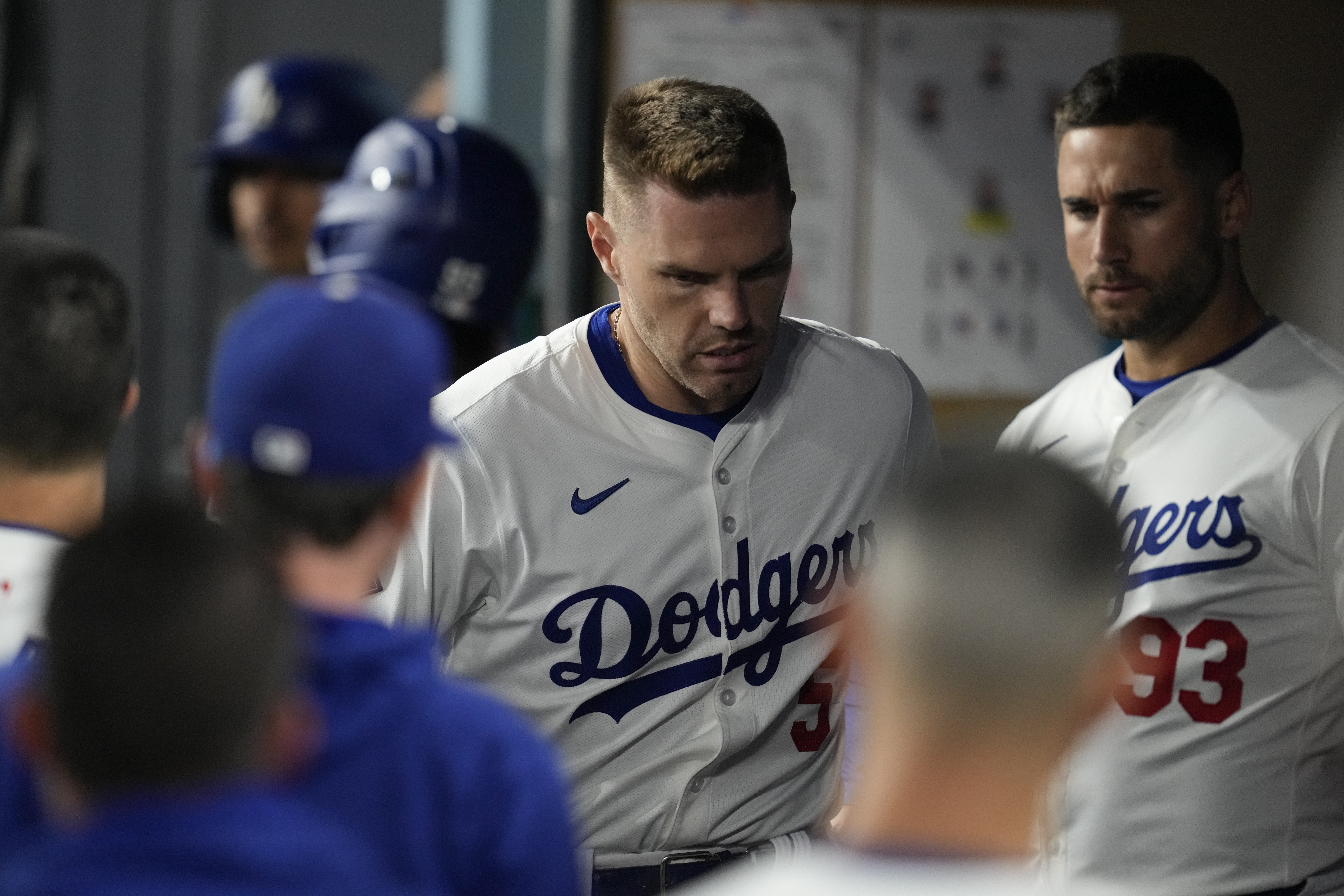 Los Angeles Dodgers' Freddie Freeman reacts in the dugout after an injury during the seventh inning of a baseball game against the San Diego Padres Thursday, Sept. 26, 2024, in Los Angeles. 