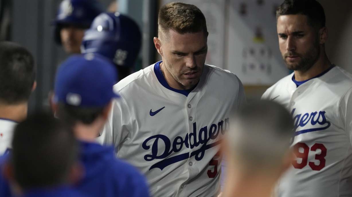 Los Angeles Dodgers' Freddie Freeman reacts in the dugout after an injury during the seventh inning of a baseball game against the San Diego Padres Thursday, Sept. 26, 2024, in Los Angeles.