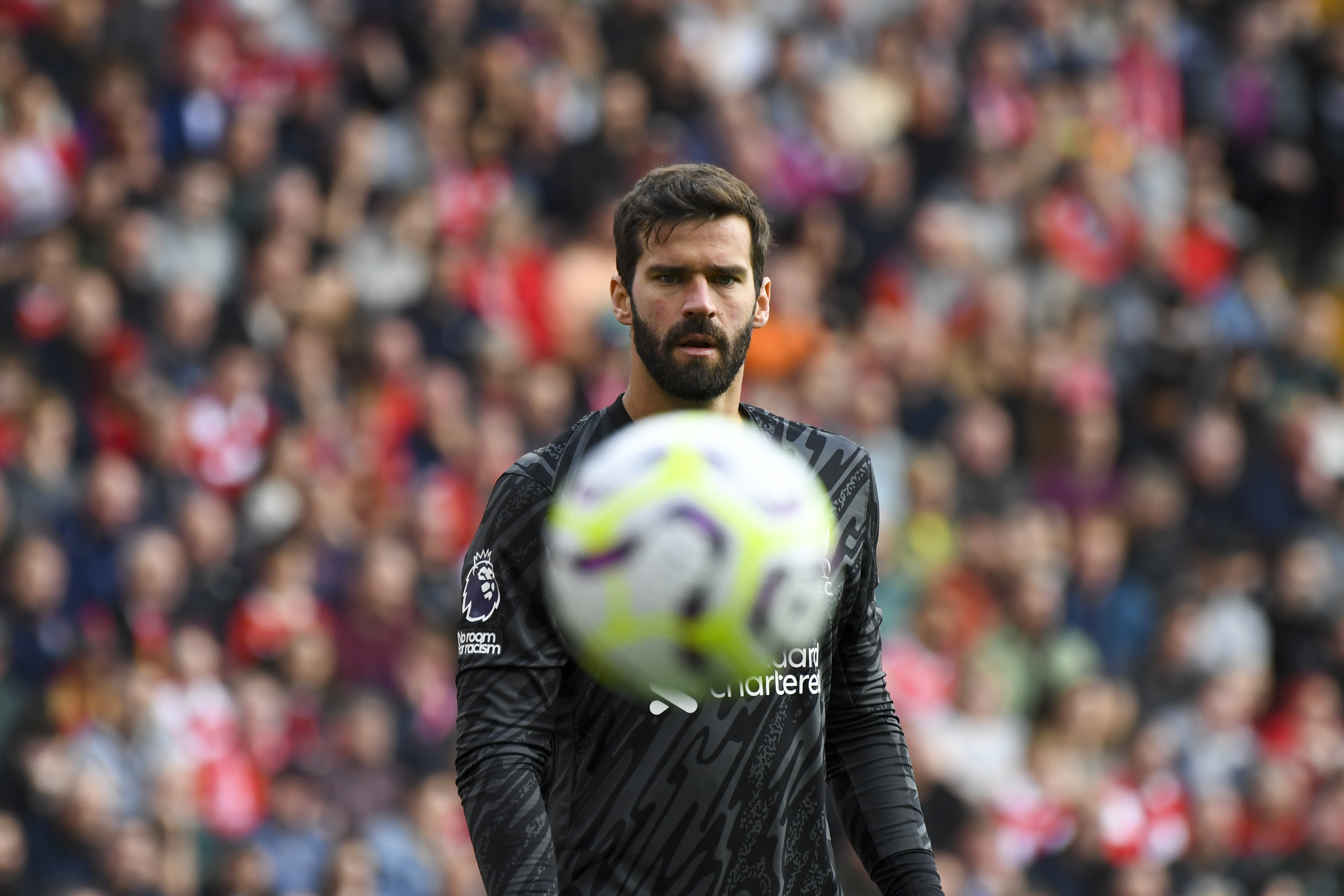 Liverpool's goalkeeper Alisson looks the ball during the English Premier League soccer match between Liverpool and Nottingham Forest at Anfield Stadium in Liverpool, England, Saturday, Sept. 14, 2024.