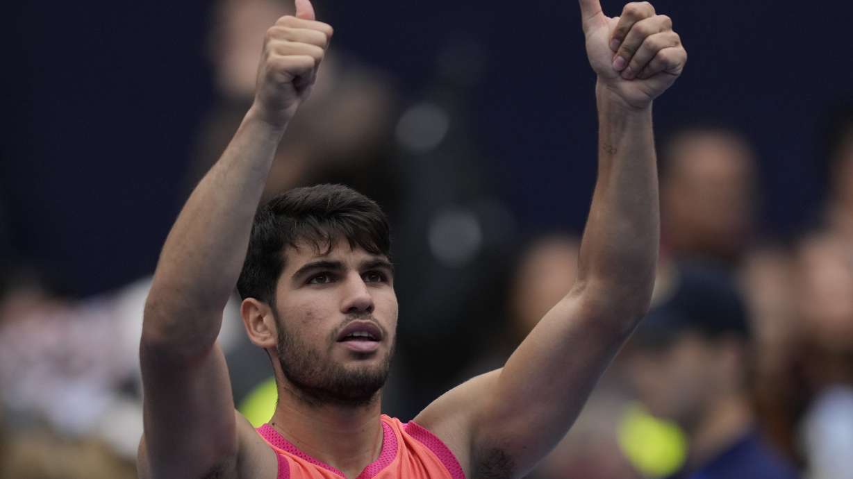 Carlos Alcaraz of Spain celebrates after defeating Giovanni Mpetshi Perricard of France during the China Open tennis tournament held at the National Tennis Center in Beijing, Friday, Sept. 27, 2024.