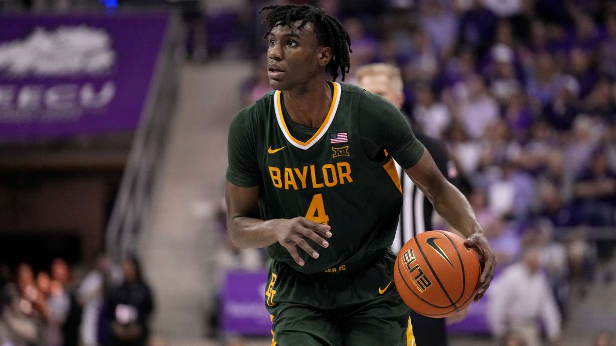FILE - Baylor guard Ja'Kobe Walter (4) handles the ball during the second half of an NCAA college basketball game against TCU in Fort Worth, Texas, Feb. 26, 2024.