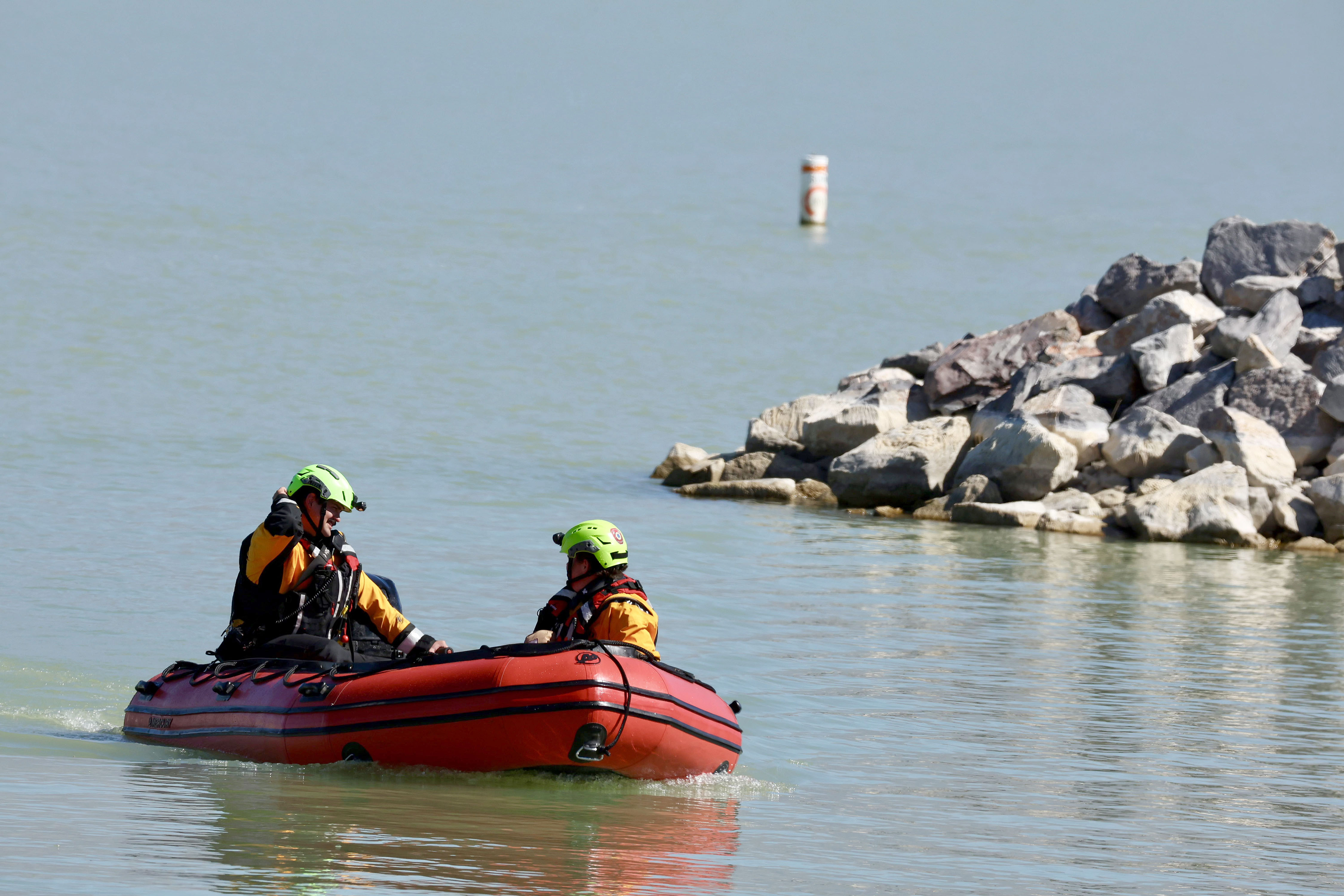 Members of Saratoga Springs Fire and Rescue return to the Saratoga Springs Marina after searching for a reported plane crash on Utah Lake on Friday.