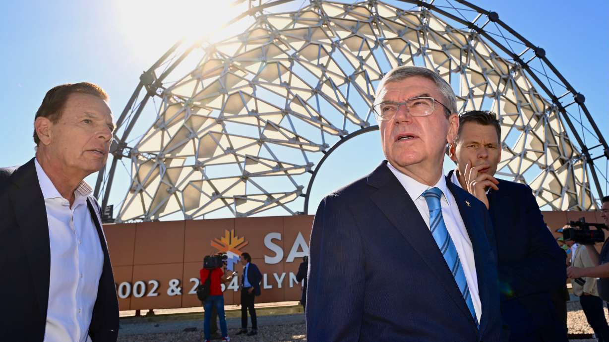Fraser Bullock joins International Olympic Committee President Thomas Bach at the Salt Lake City International Airport as he leads a delegation visiting Utah ahead of the 2034 Winter Olympics, on Friday.