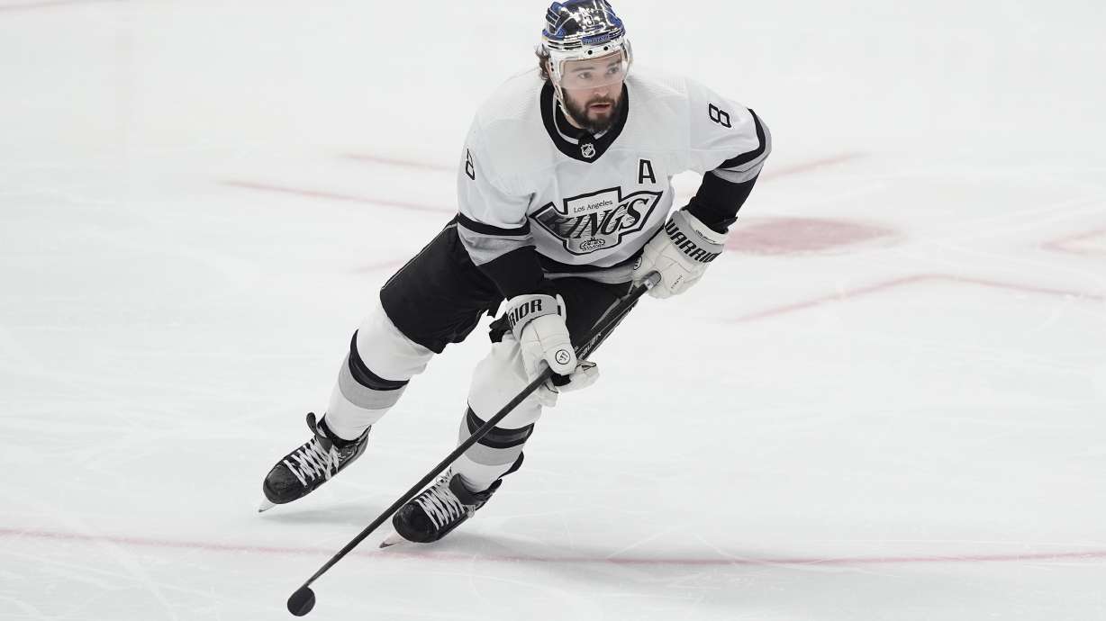 FILE - Los Angeles Kings defenseman Drew Doughty (8) skates with the puck during the first period an NHL hockey game against the Dallas Stars in Dallas, March 16, 2024.