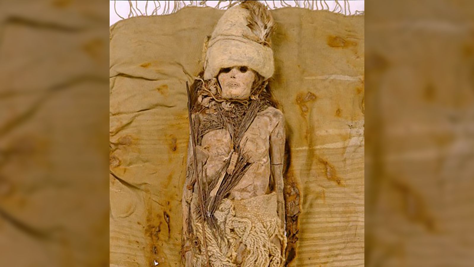 A mummy from the Xiaohe cemetery in the arid Tarim Basin, in China’s Xinjiang region, is seen with kefir cheese scattered around the neck.