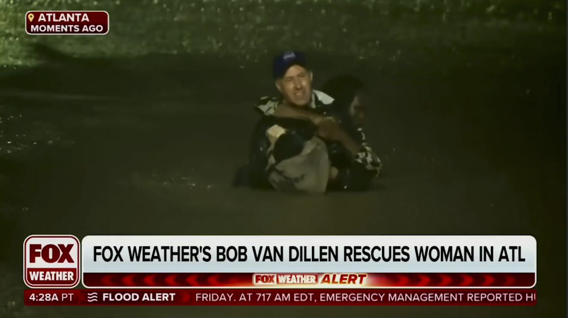 In this image made from a Fox Weather broadcast, meteorologist Bob Van Dillen rescues a woman stuck in floodwaters caused by Hurricane Helene in Atlanta, Friday.