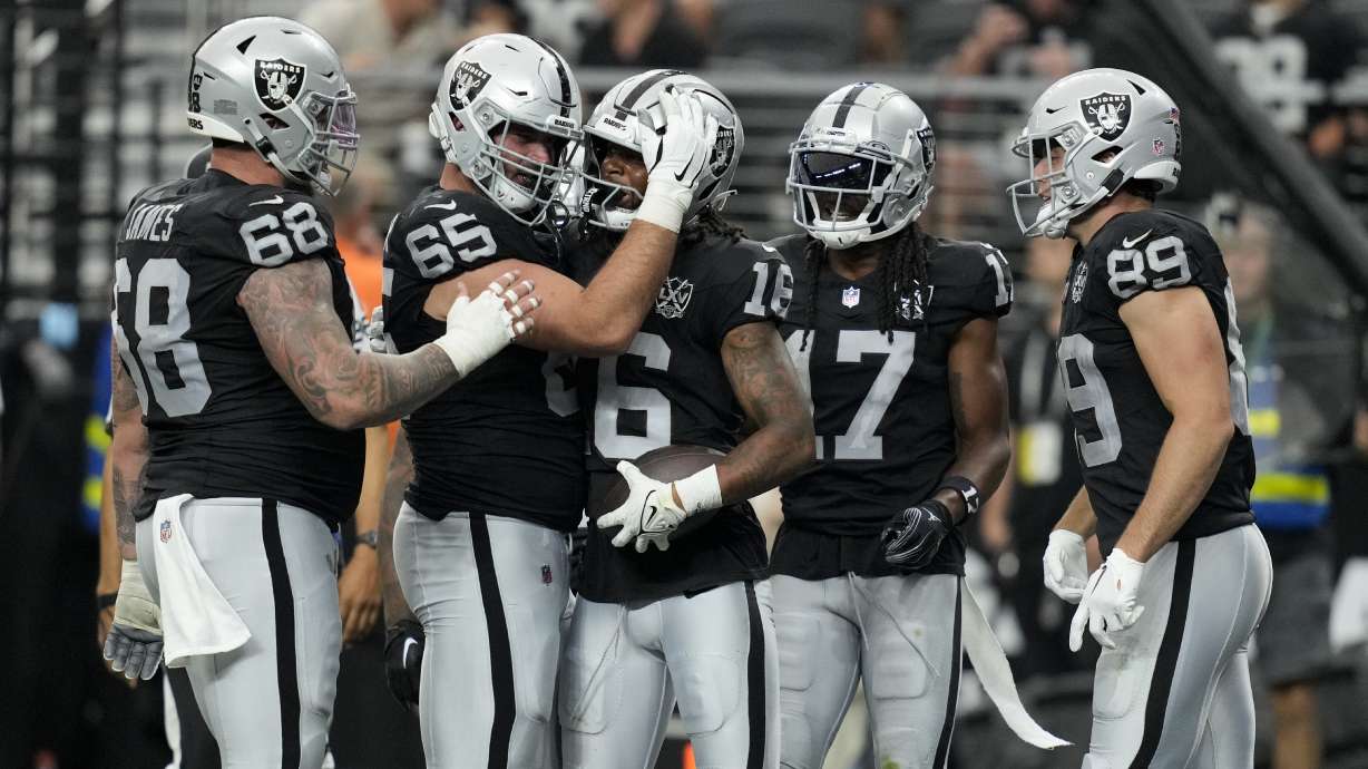 Las Vegas Raiders wide receiver Jakobi Meyers celebrates after scoring against the Carolina Panthers during the second half of an NFL football game, Sunday, Sept. 22, 2024, in Las Vegas.