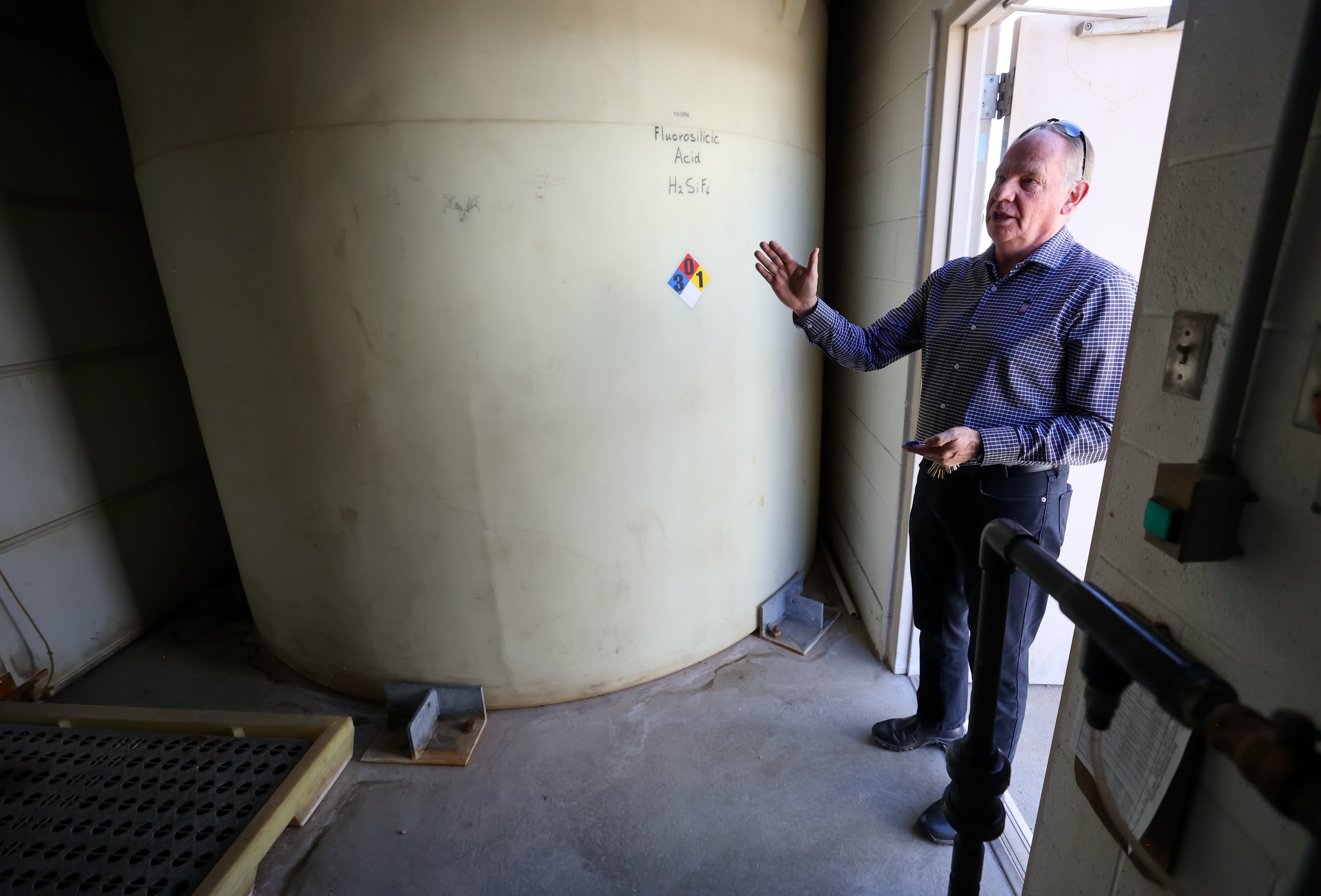 Scott Paxman, Weber Water Basin Conservancy District general manager and CEO, shows the fluoridation station at the Fairfield Well in Layton on Friday.