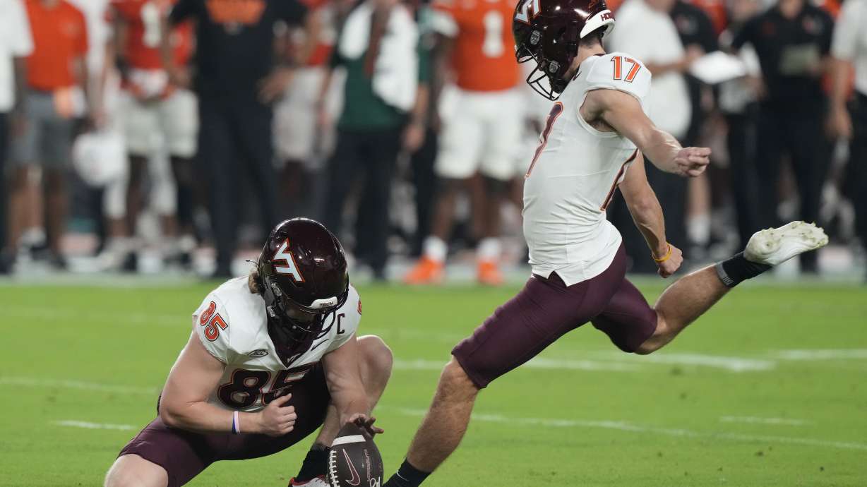 Virginia Tech place kicker John Love (17) kicks a field goal during the first half of an NCAA college football game against Miami, Friday, Sept. 27, 2024, in Miami Gardens, Fla.