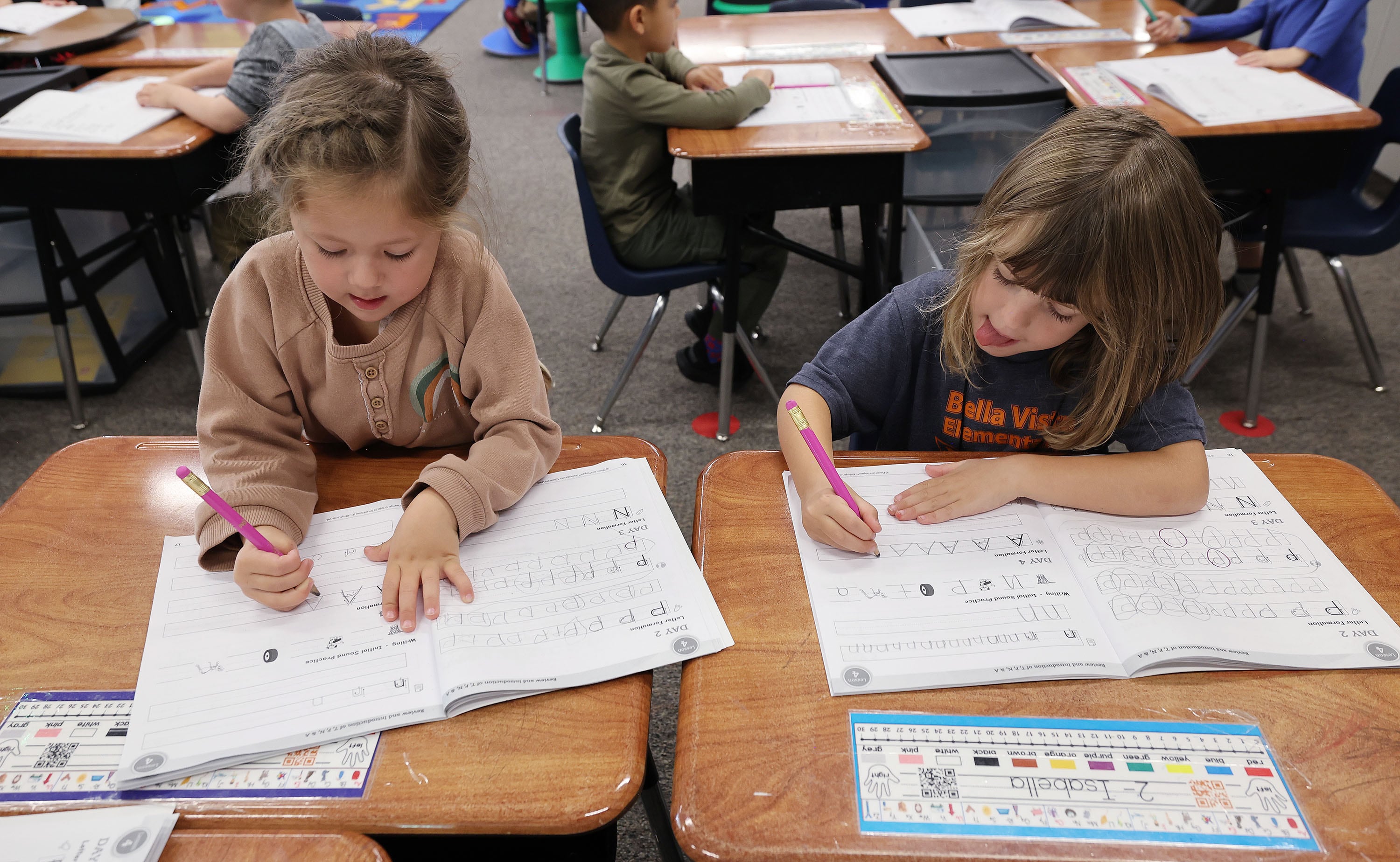 Bella Vista Elementary kindergarten students Lexi Stanworth and Isabella Bailey work in class in Cottonwood Heights on Tuesday.