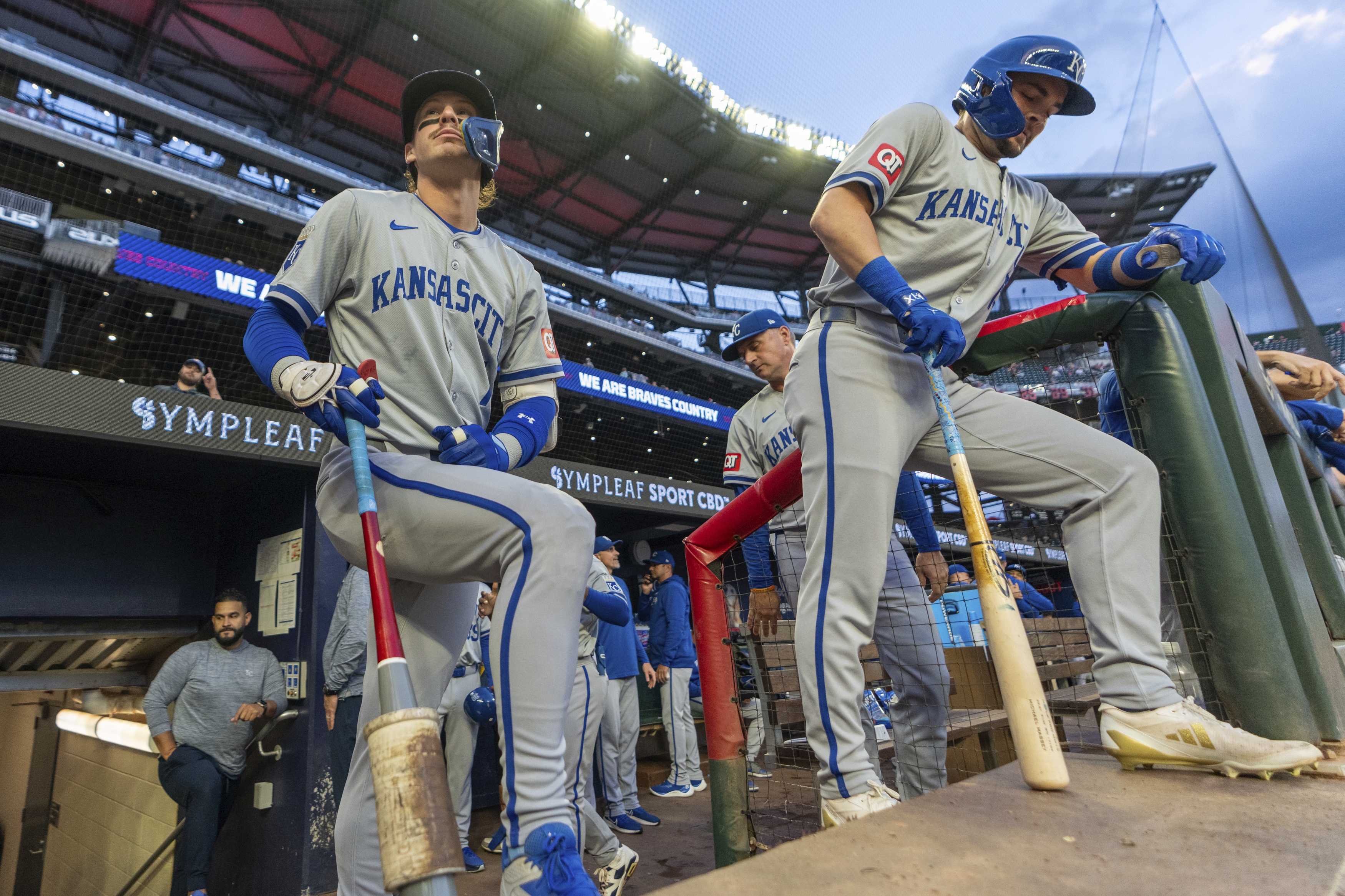 Kansas City Royals' Bobby Witt Jr., lfront eft, and Michael Massey, right, await for their turns at bat in the first inning of a baseball game against the Atlanta Braves, Friday, Sept. 27, 2024, in Atlanta. 